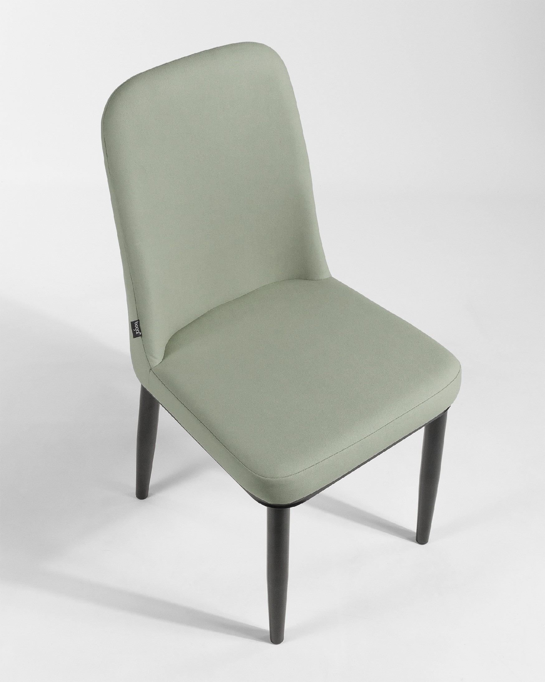 Oslo chair with moss upholstery and black legs
