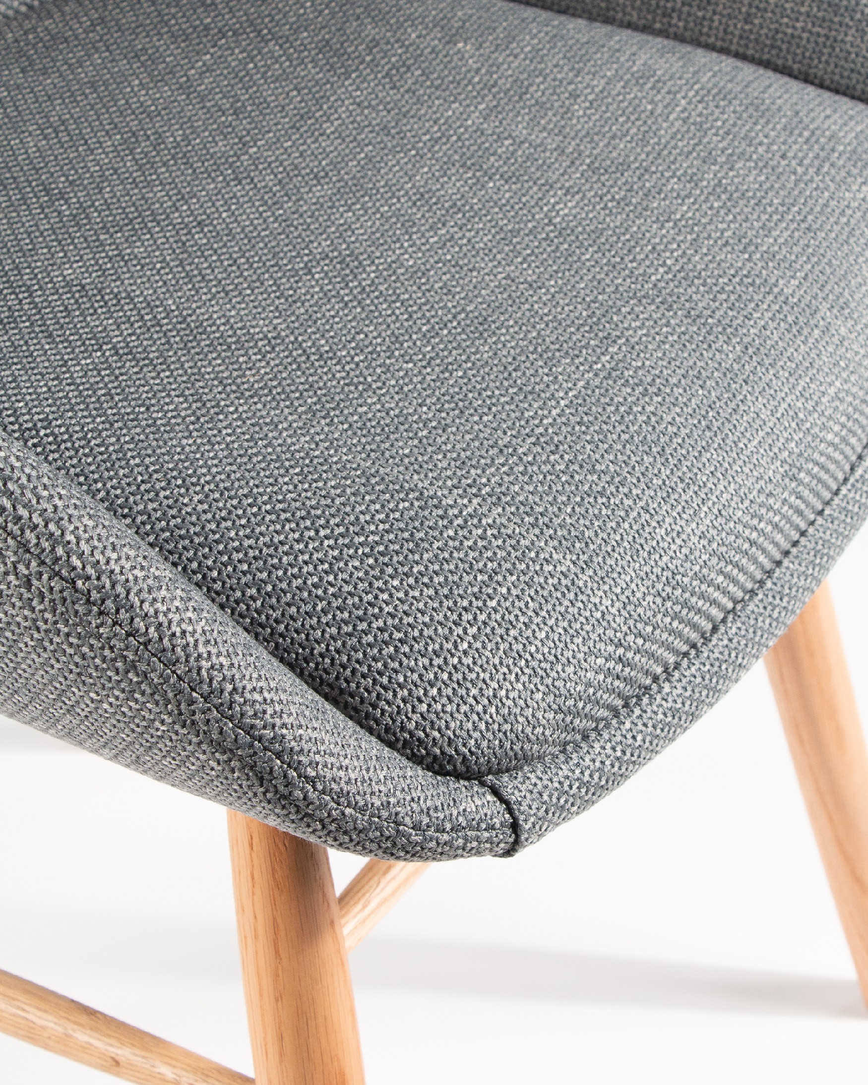 Ottawa chair with gray upholstery and wooden legs