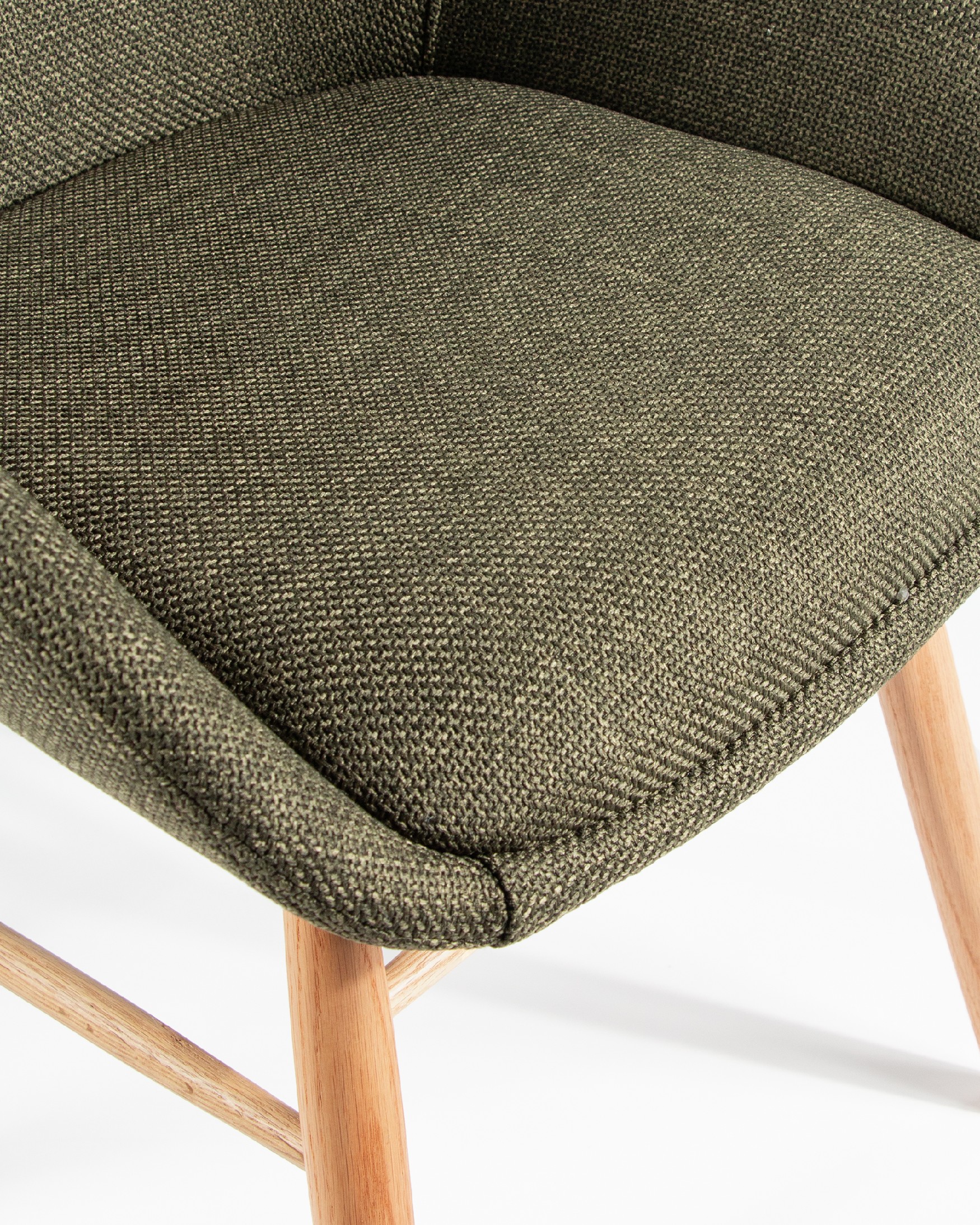 Ottawa chair with green upholstery and wooden legs