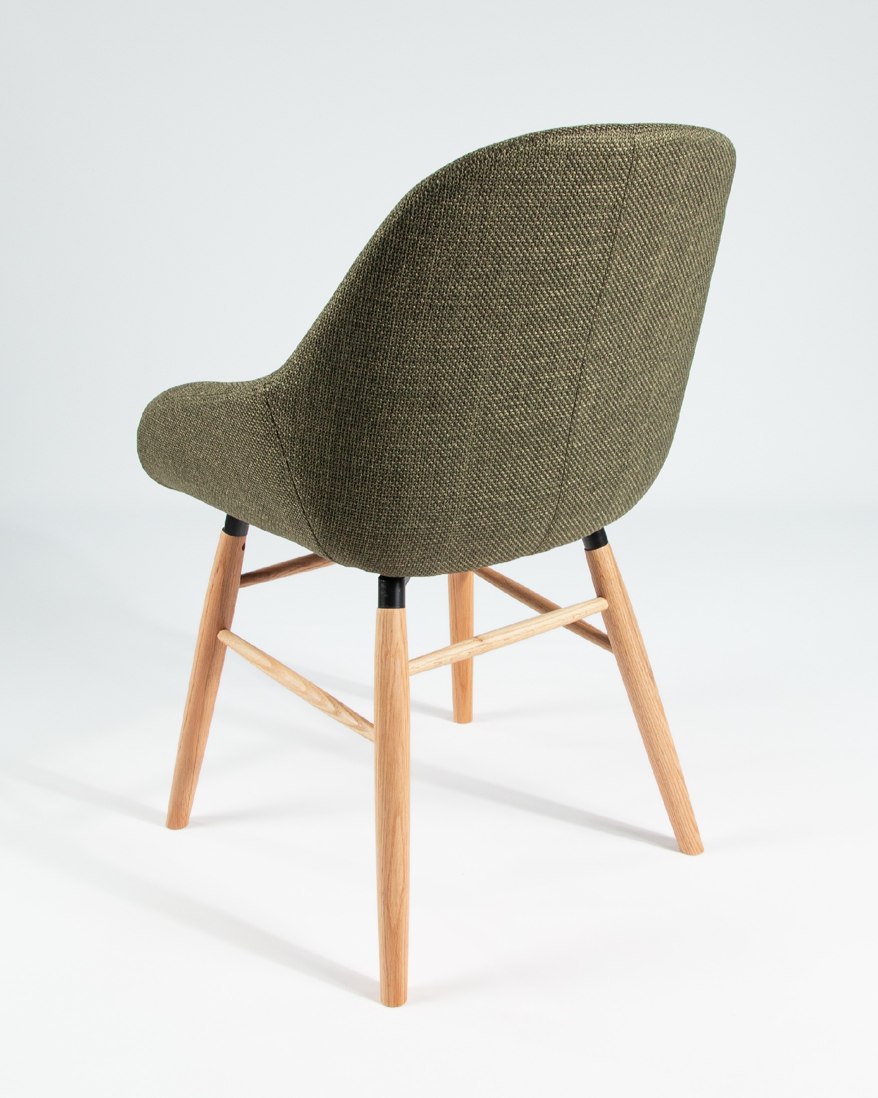 Ottawa chair with green upholstery and wooden legs