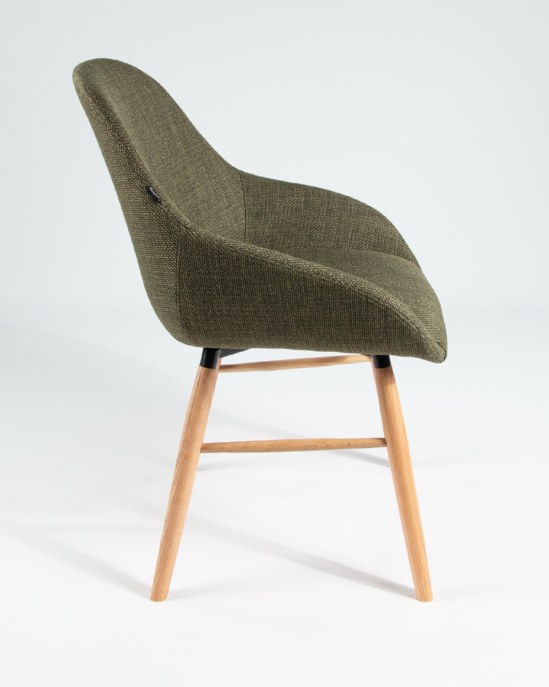 Ottawa chair with green upholstery and wooden legs