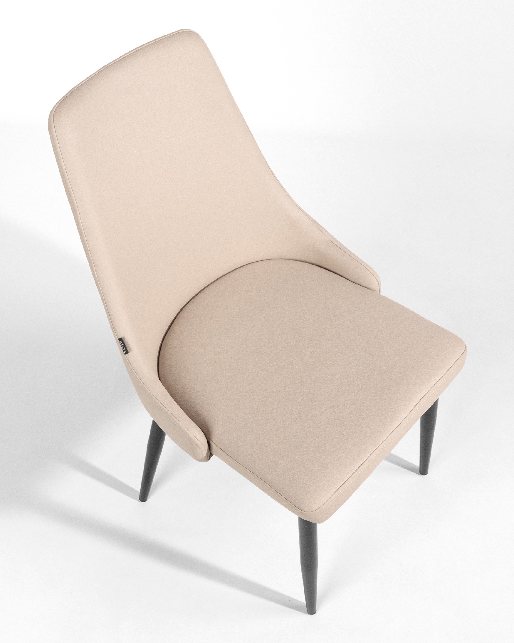 París chair with beige upholstery and black legs