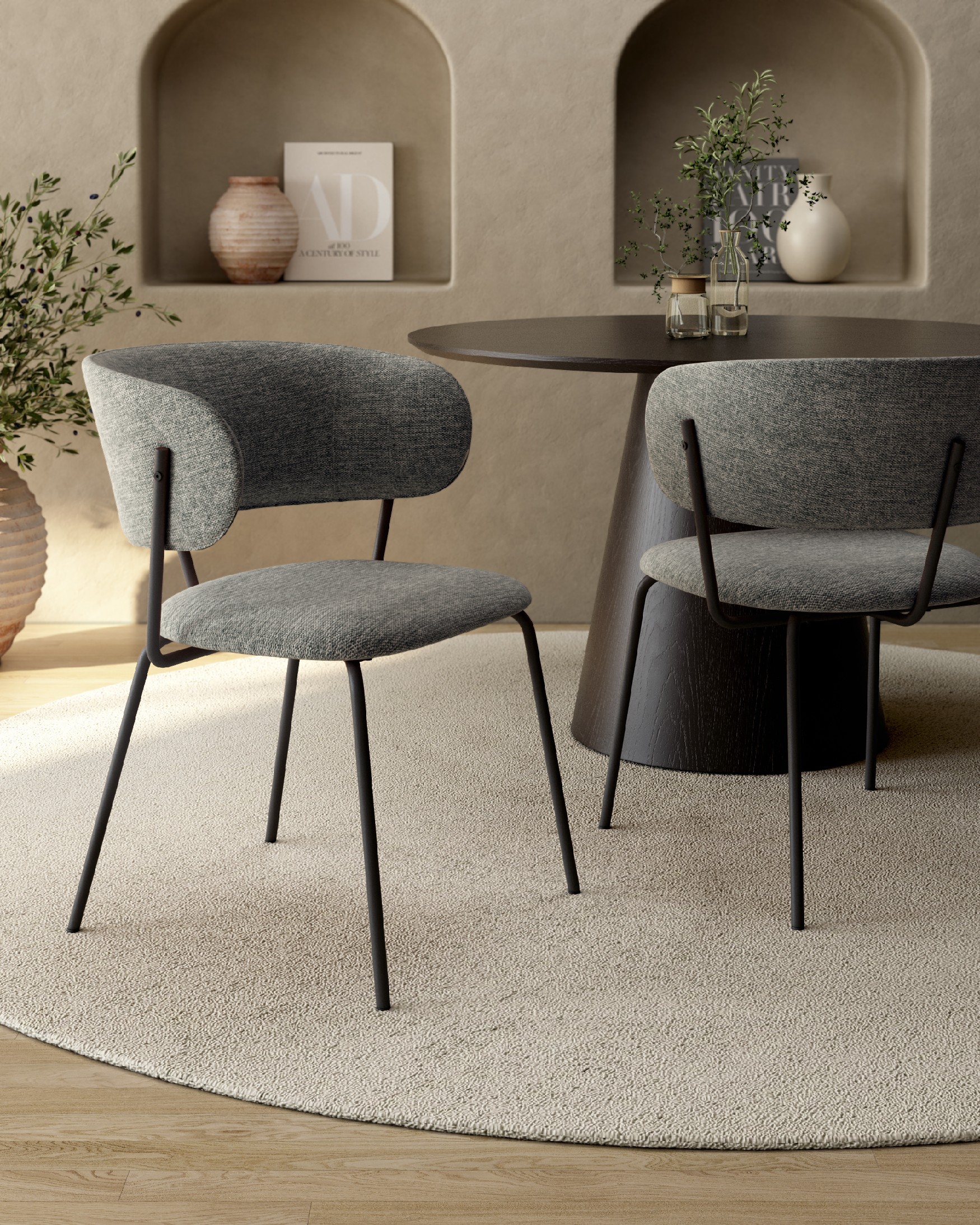 Quebec chair with gray upholstery and black metal legs