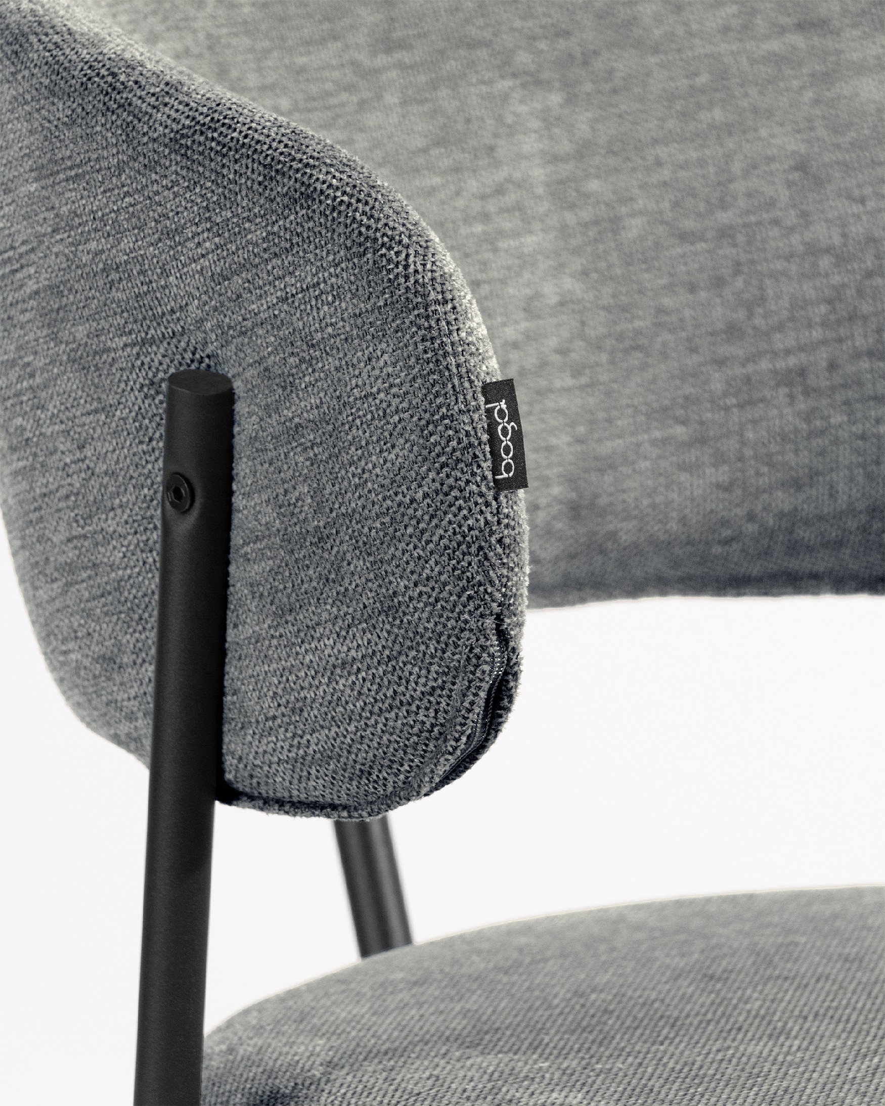 Quebec chair with gray upholstery and black metal legs