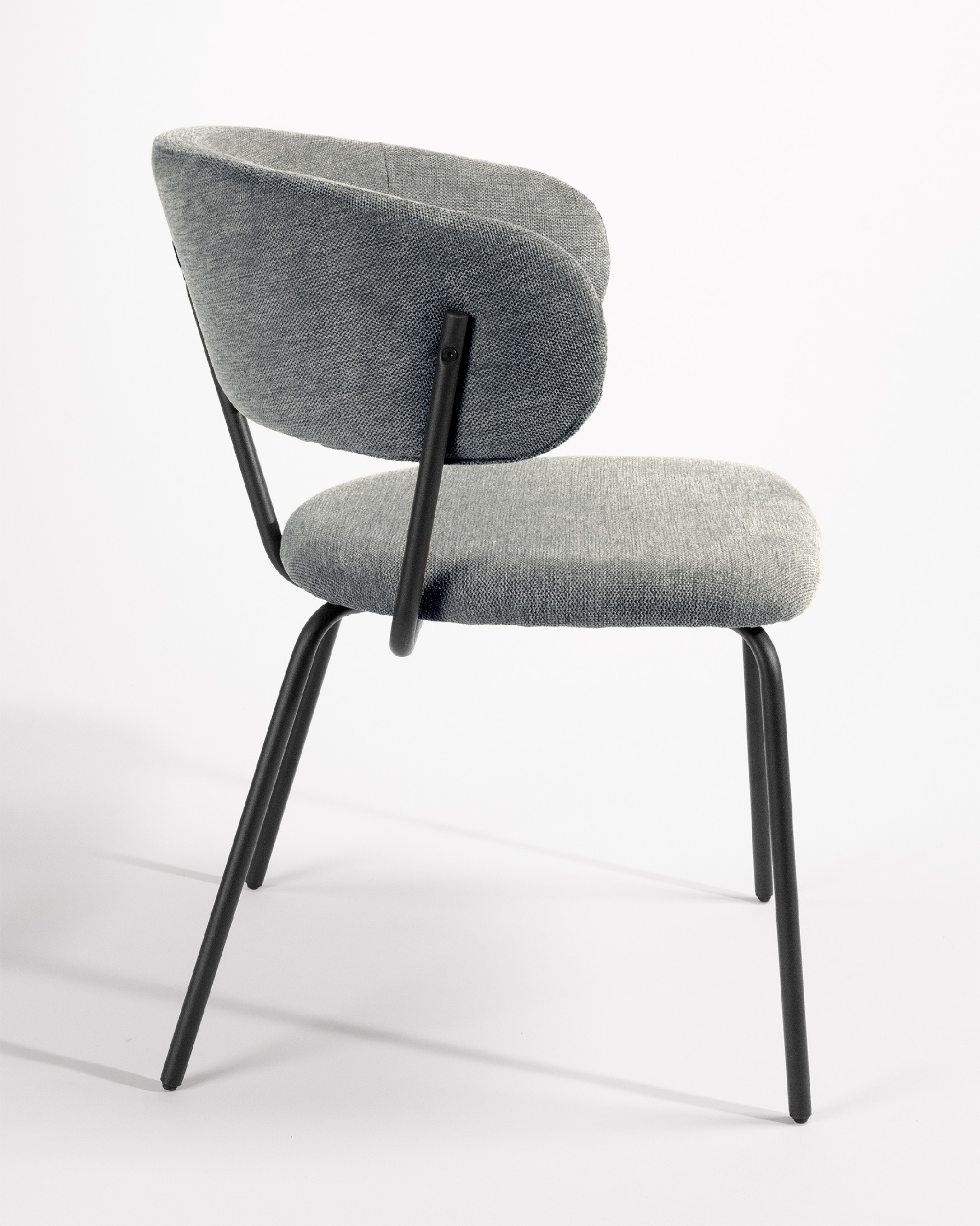 Quebec chair with gray upholstery and black metal legs
