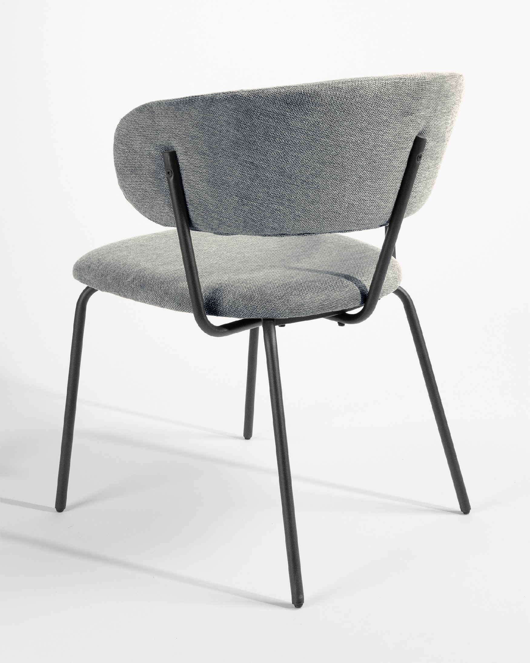 Quebec chair with gray upholstery and black metal legs