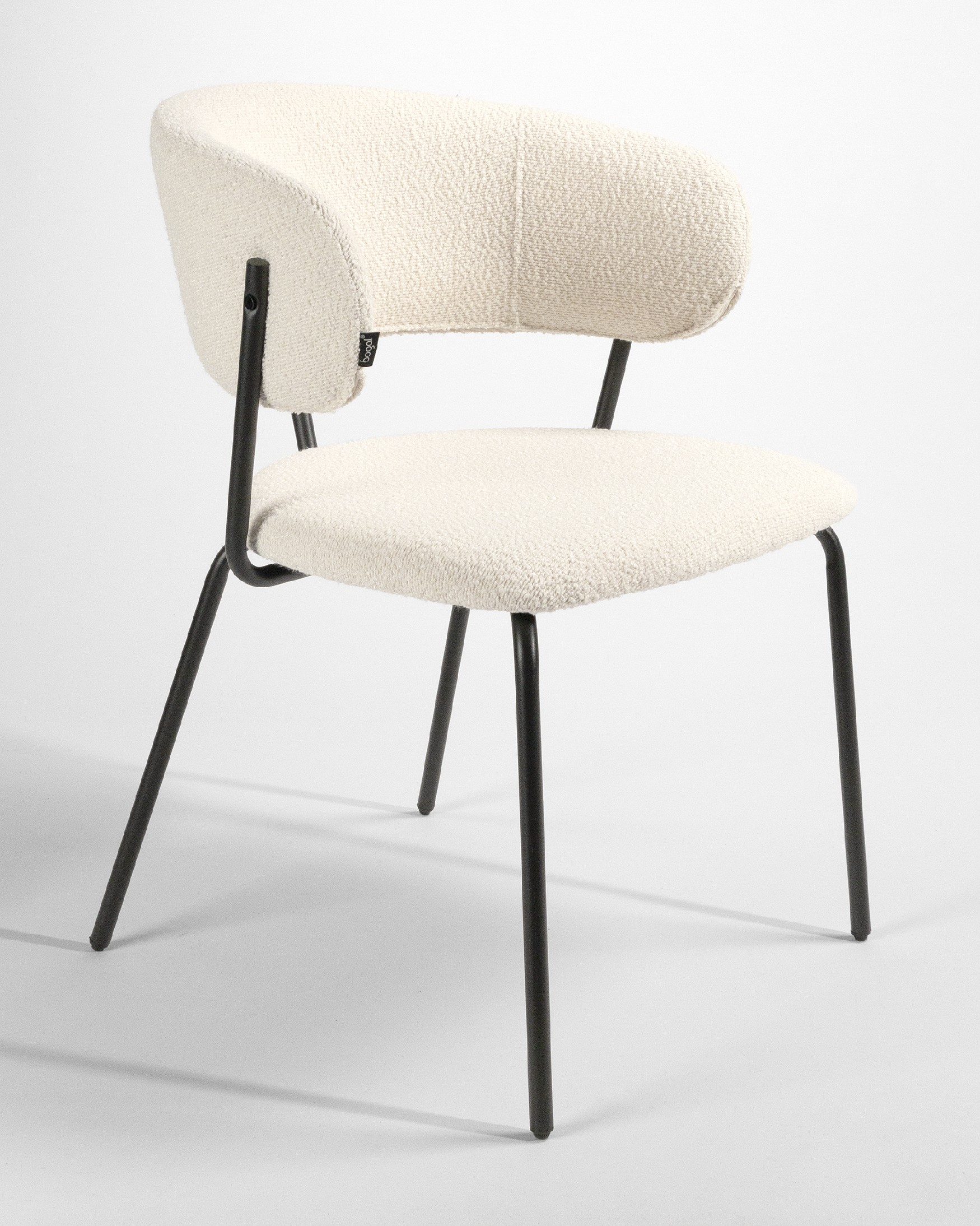 Quebec chair with off-white upholstery and black metal legs