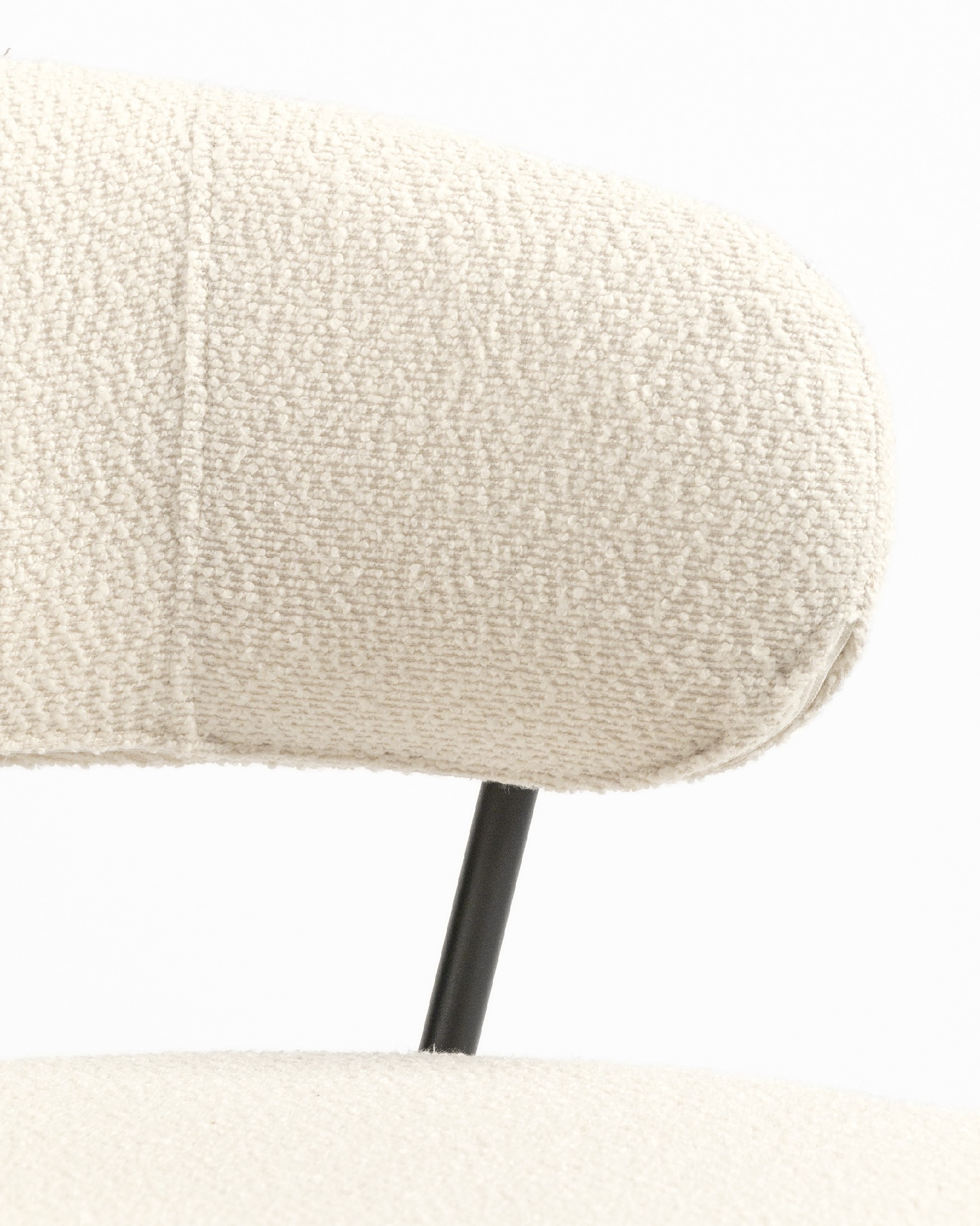 Quebec chair with off-white upholstery and black metal legs