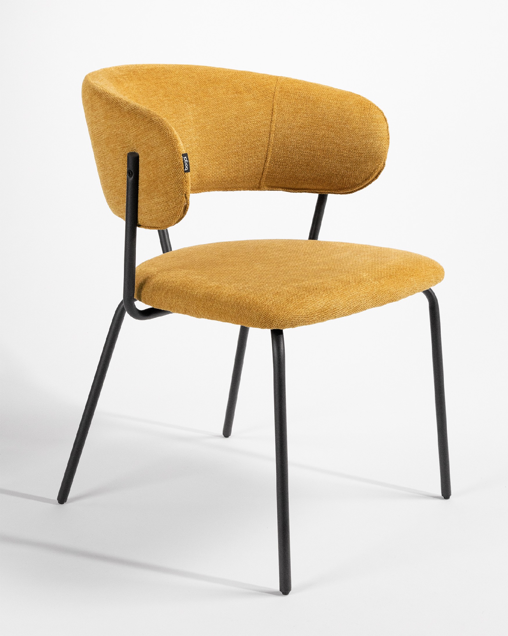Quebec chair with mustard upholstery and black metal legs