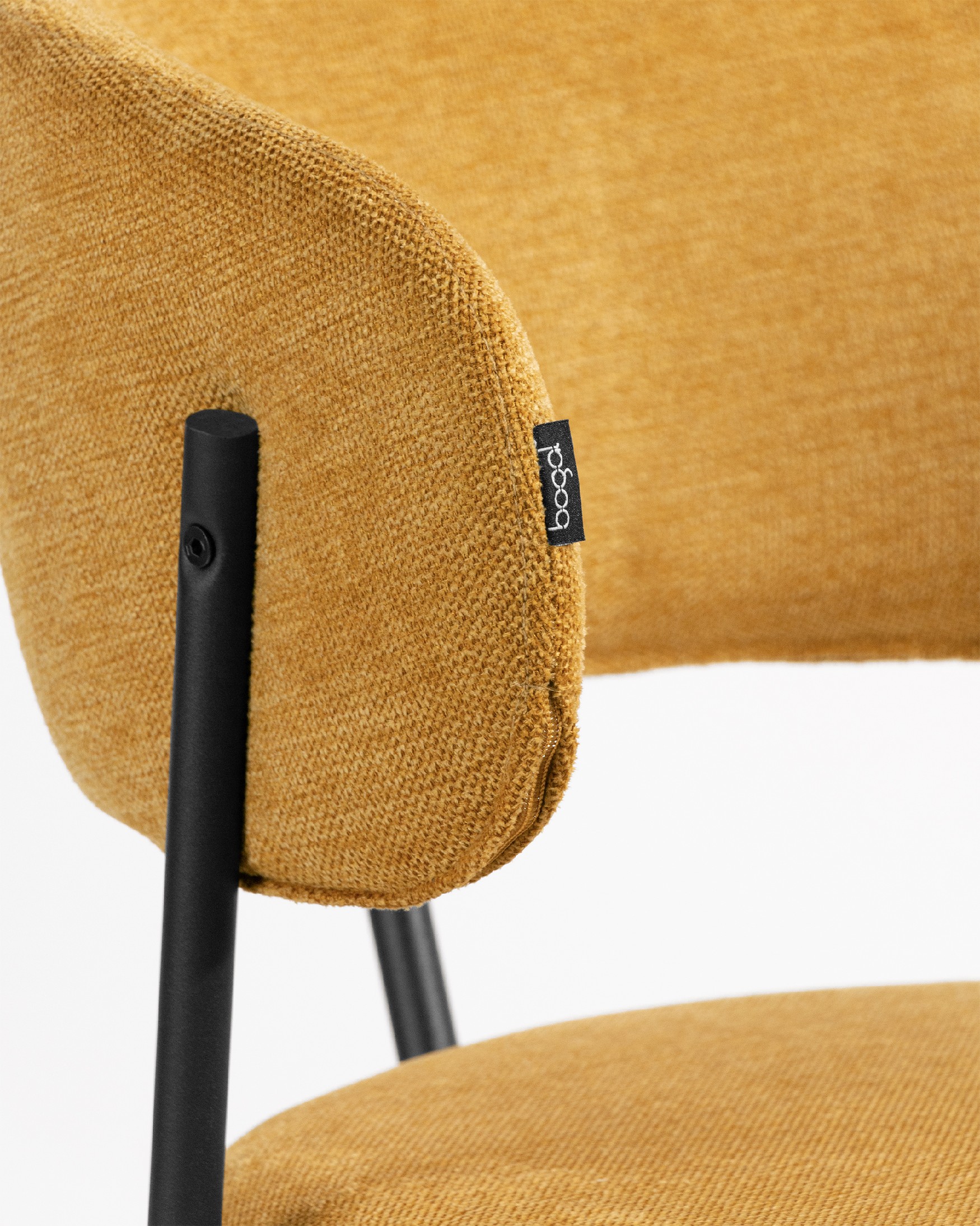 Quebec chair with mustard upholstery and black metal legs