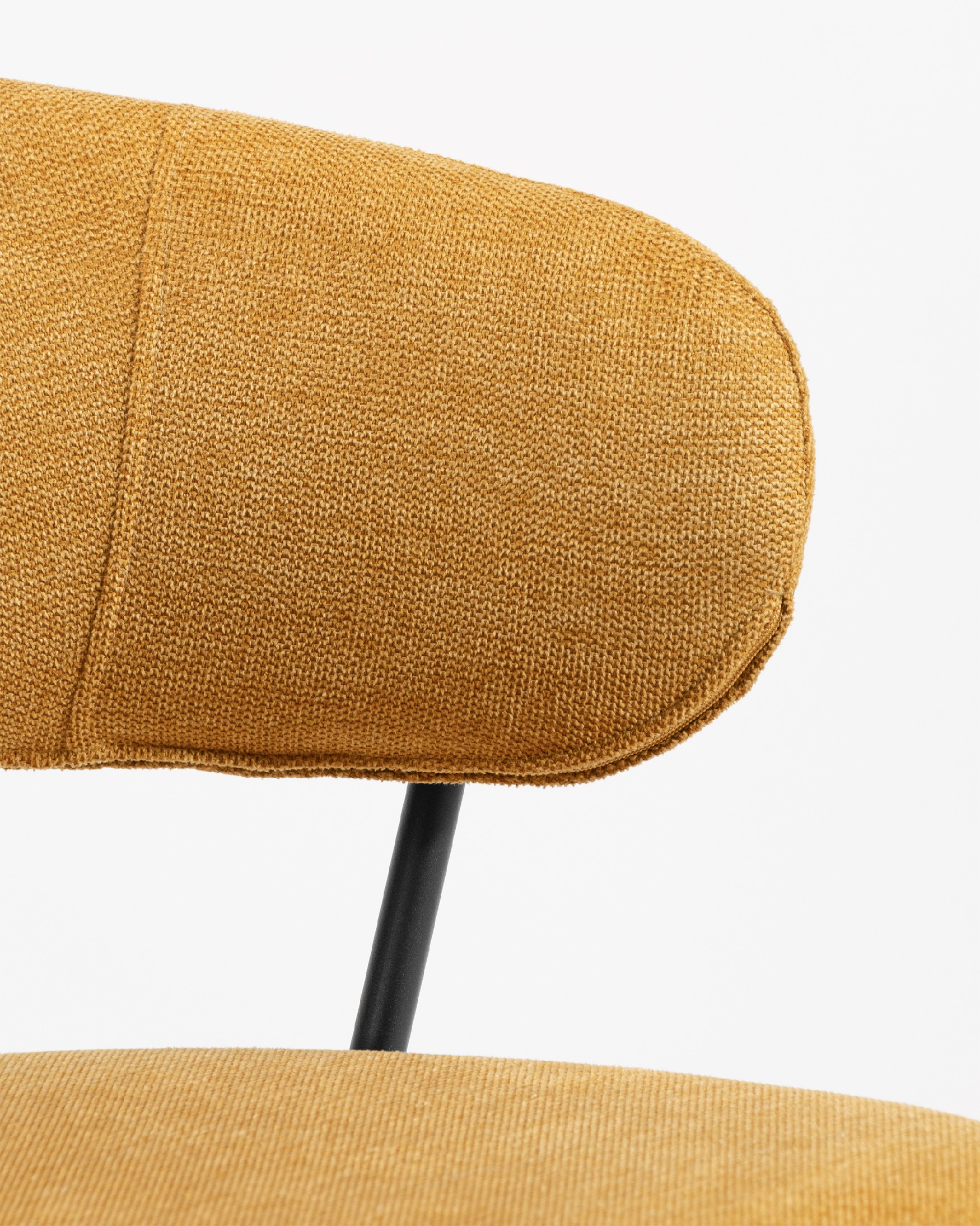 Quebec chair with mustard upholstery and black metal legs