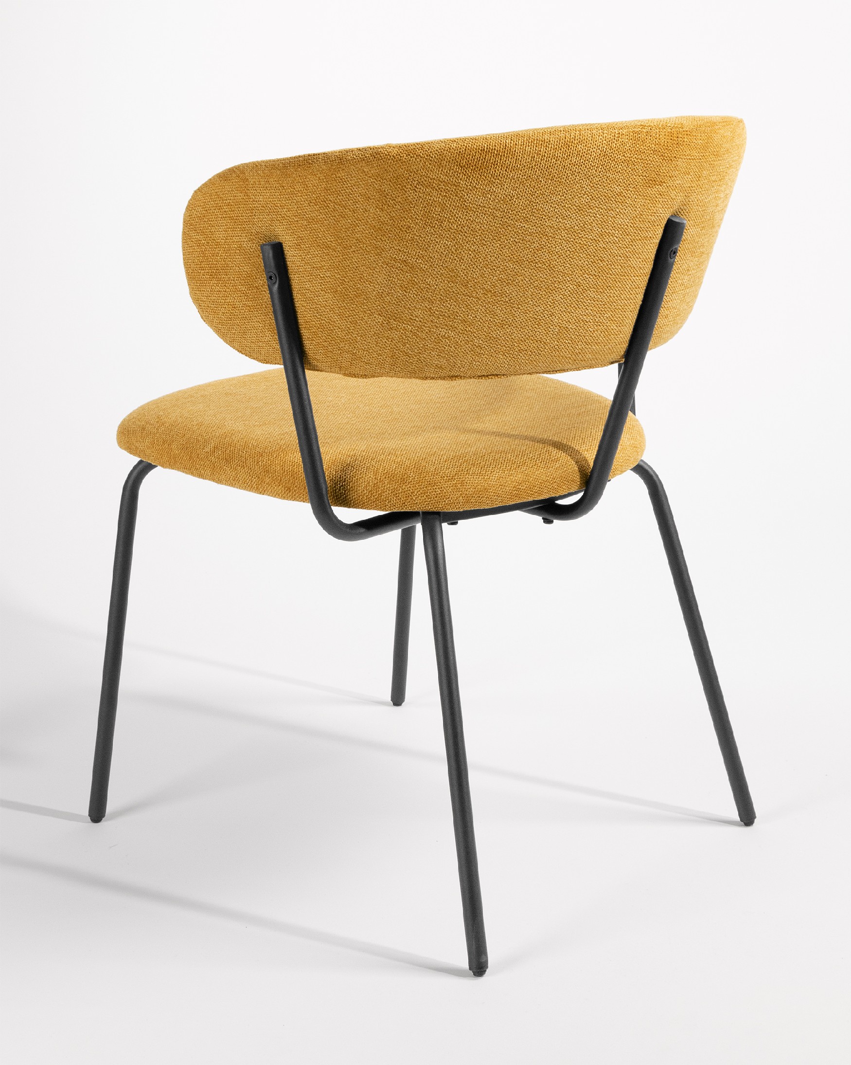 Quebec chair with mustard upholstery and black metal legs