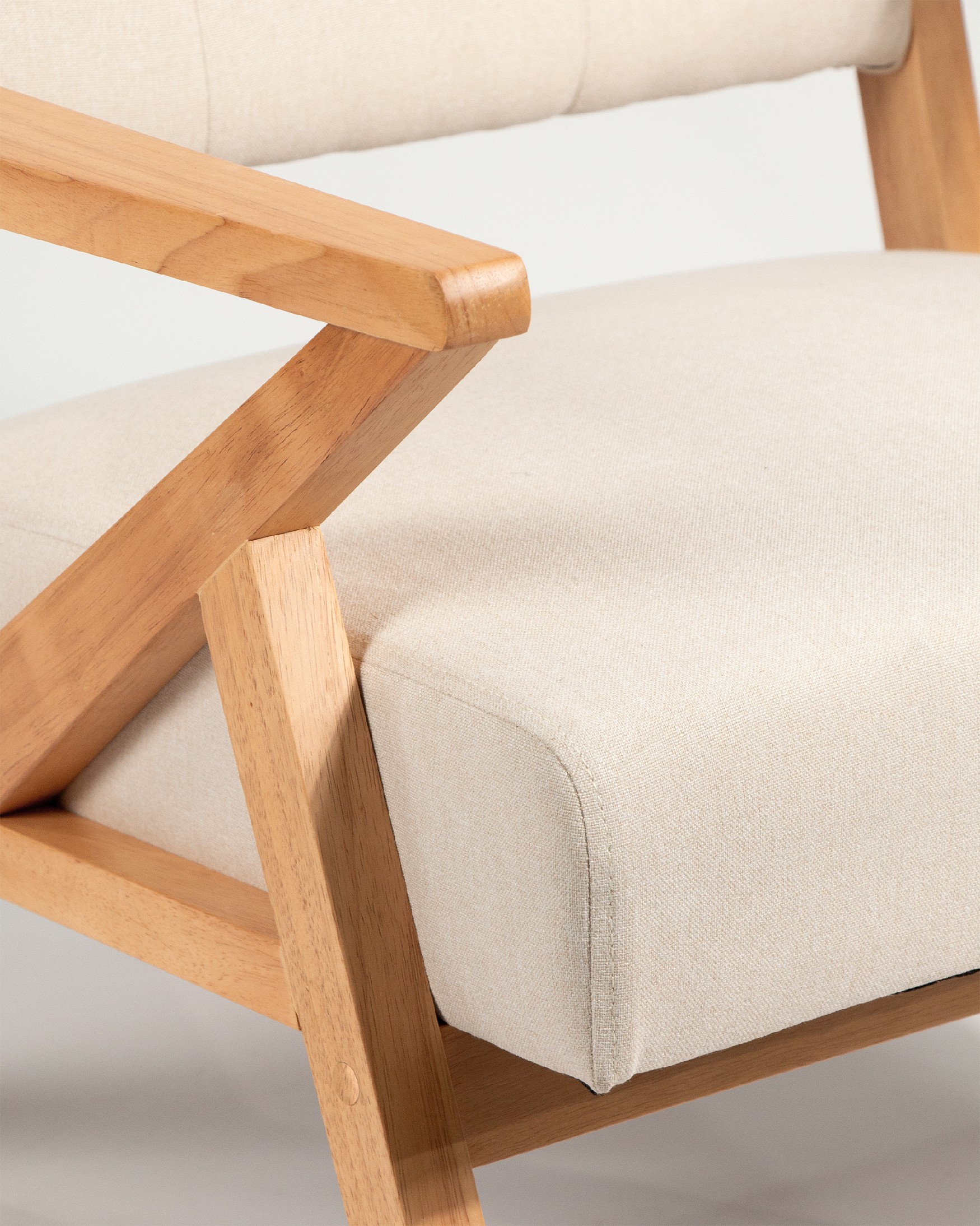 Sakura armchair with sand upholstery and light wood finish
