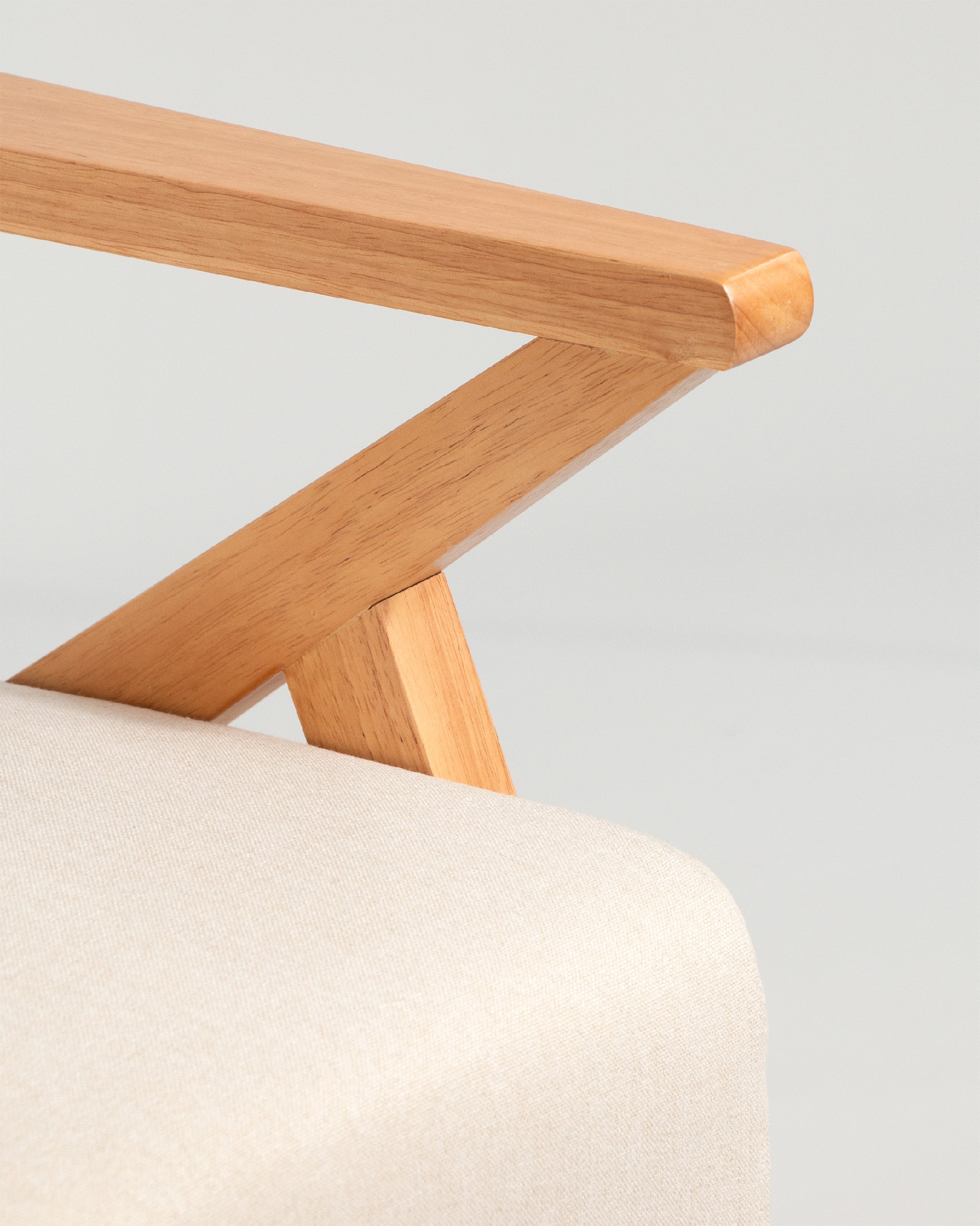 Sakura armchair with sand upholstery and light wood finish