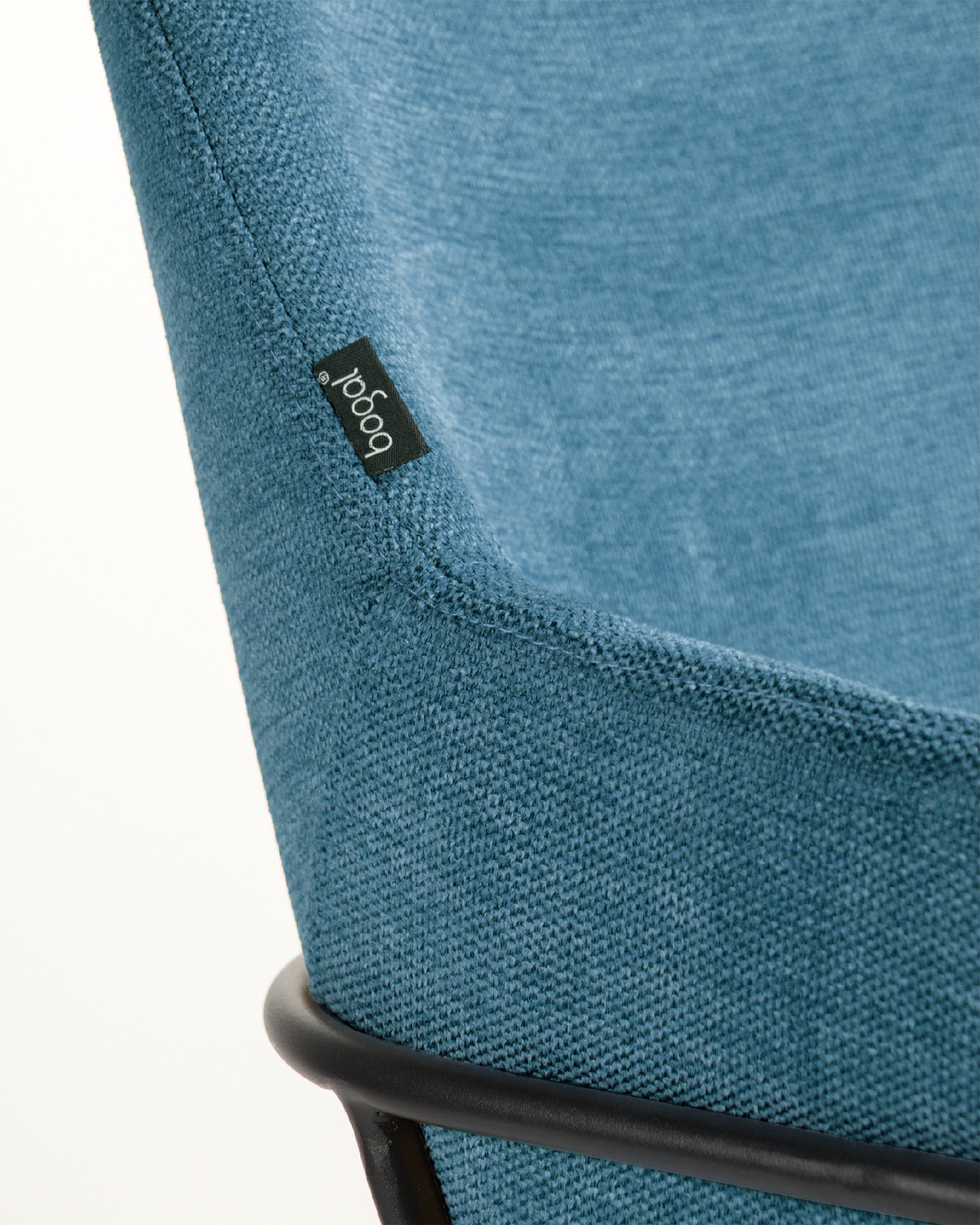 Sidney chair with blue upholstery and black metal legs