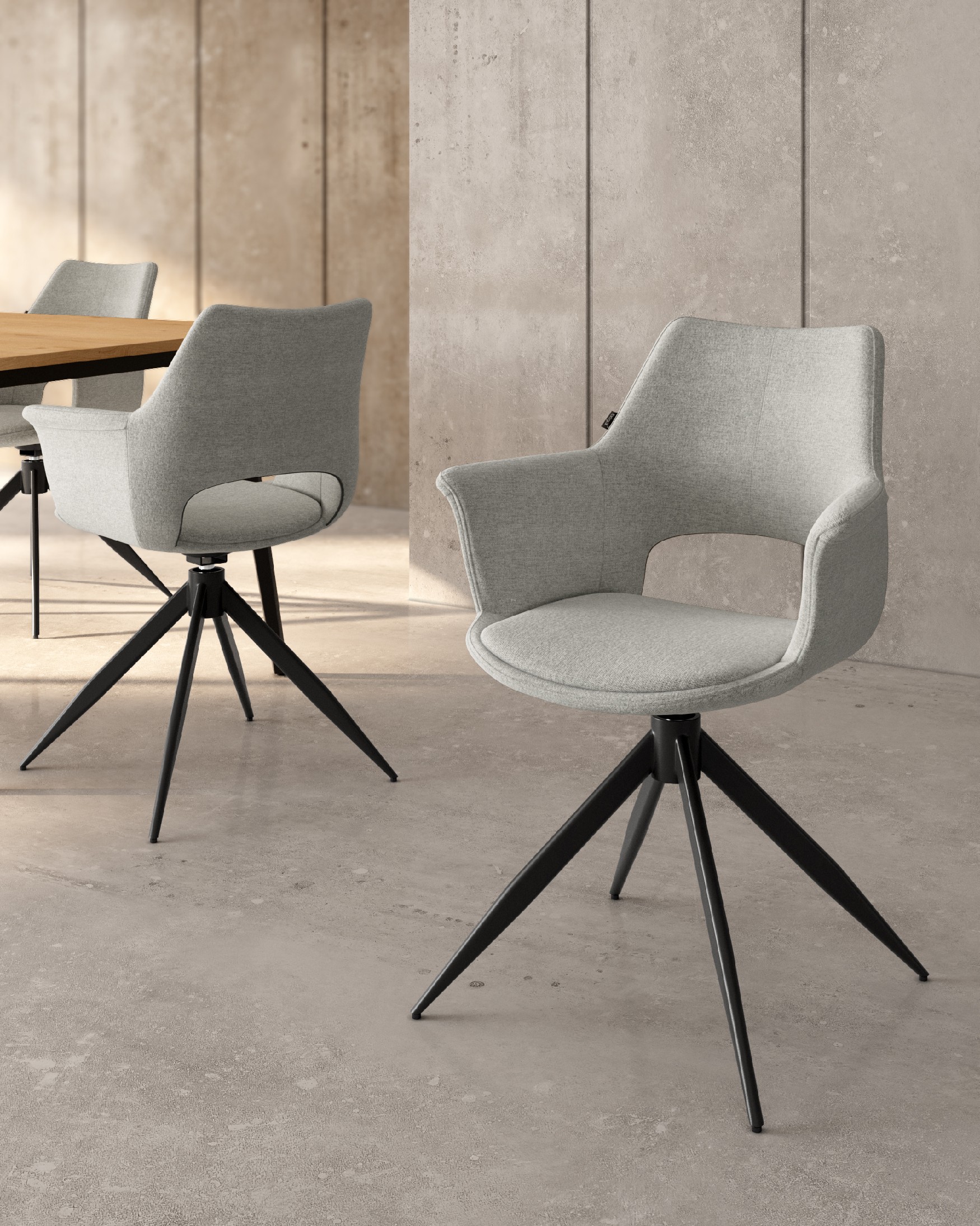 Silla Toronto con tapizado gris claro y patas metálicas negras, giratoria 360°