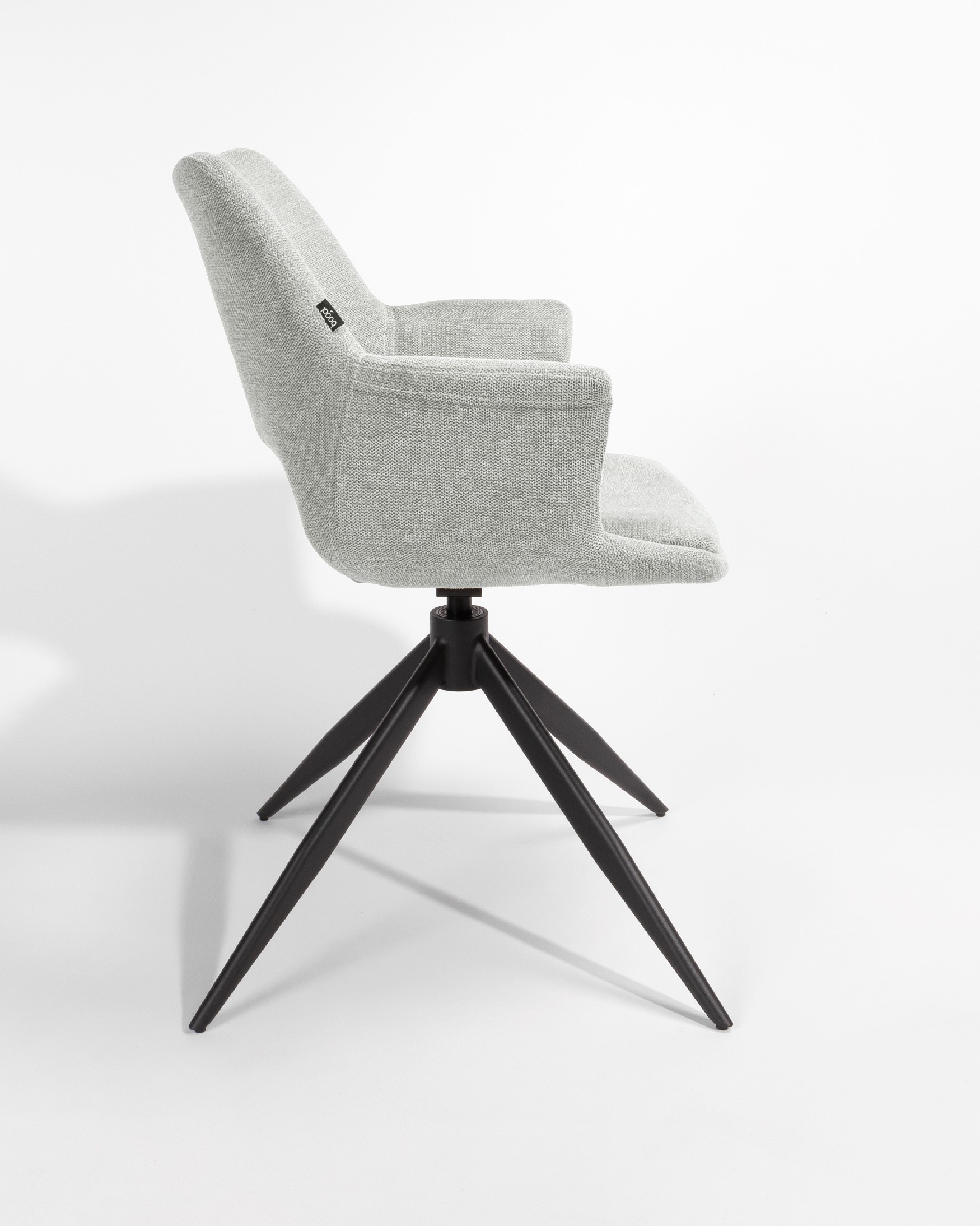 Silla Toronto con tapizado gris claro y patas metálicas negras, giratoria 360°