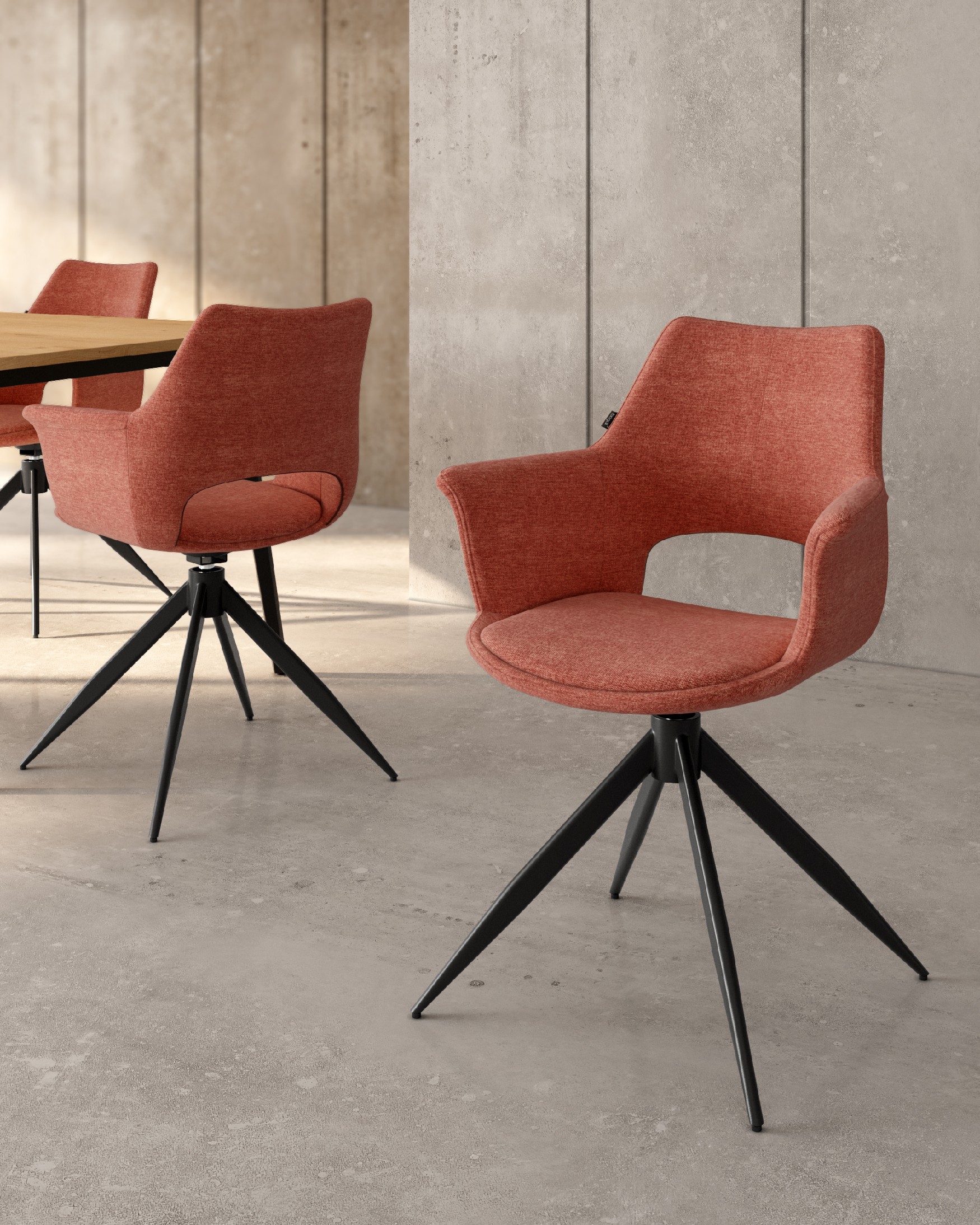 Silla Toronto con tapizado salmón y patas metálicas negras, giratoria 360°