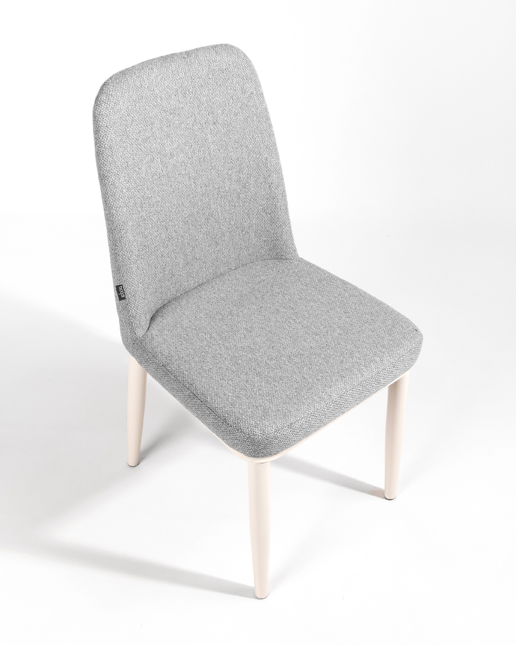 Tromso chair with gray upholstery and ivory metal legs