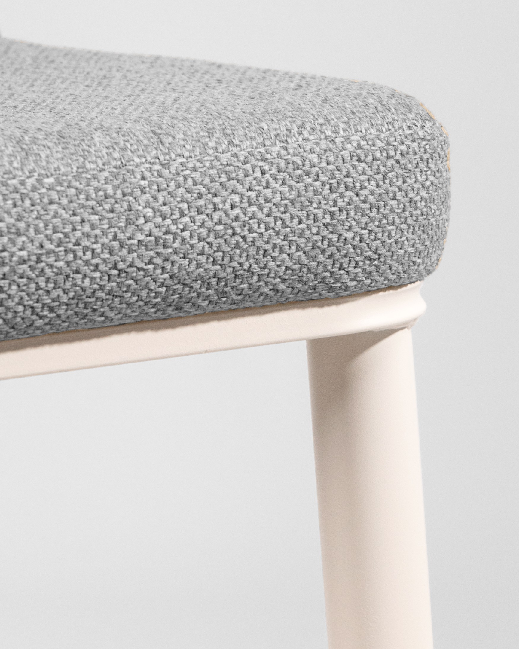Tromso chair with gray upholstery and ivory metal legs