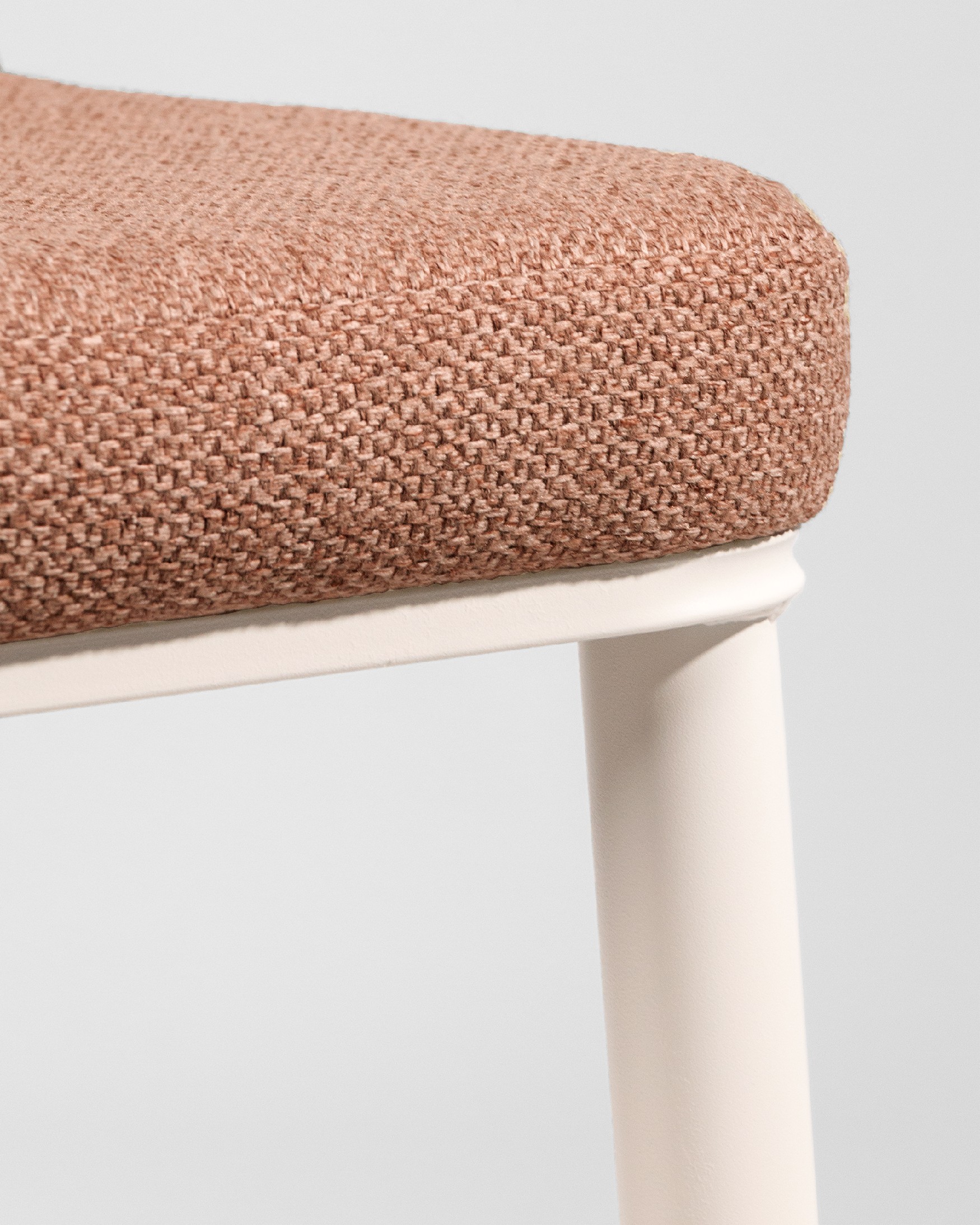 Tromso chair with salmon upholstery and ivory metal legs
