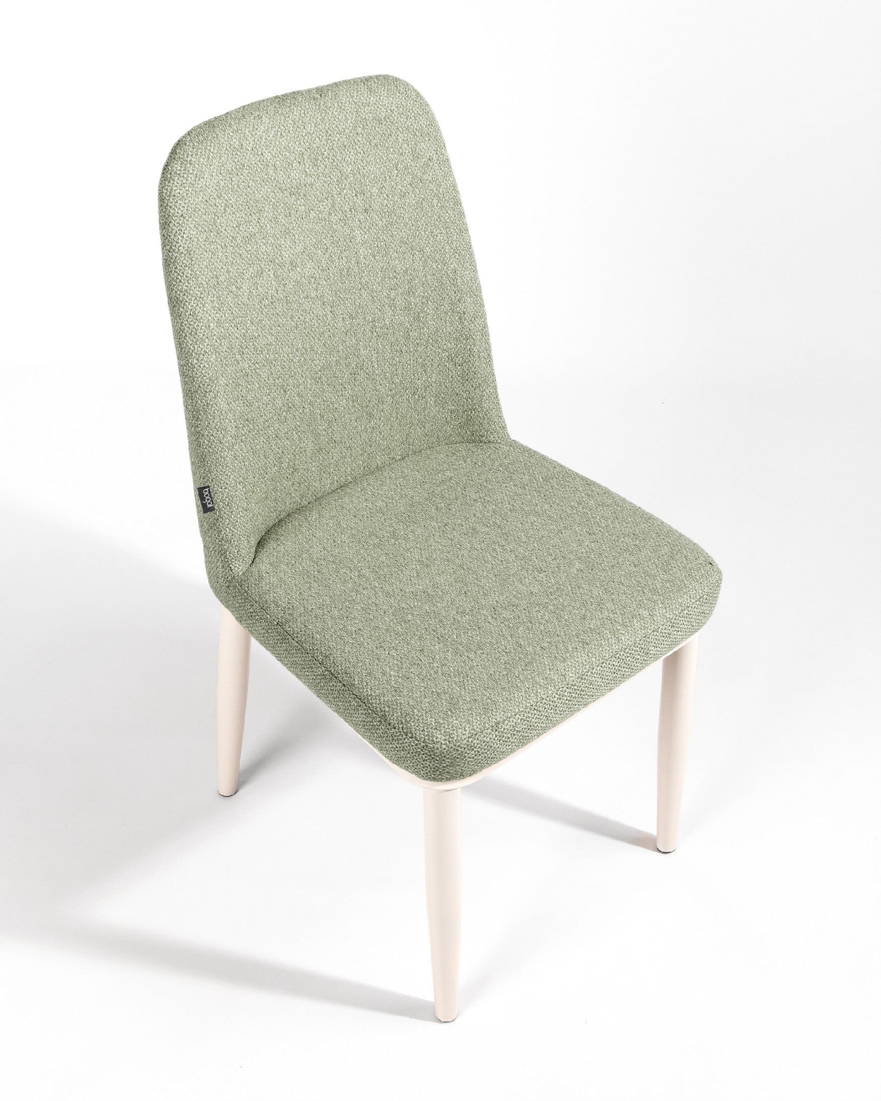 Tromso chair with green upholstery and ivory metal legs