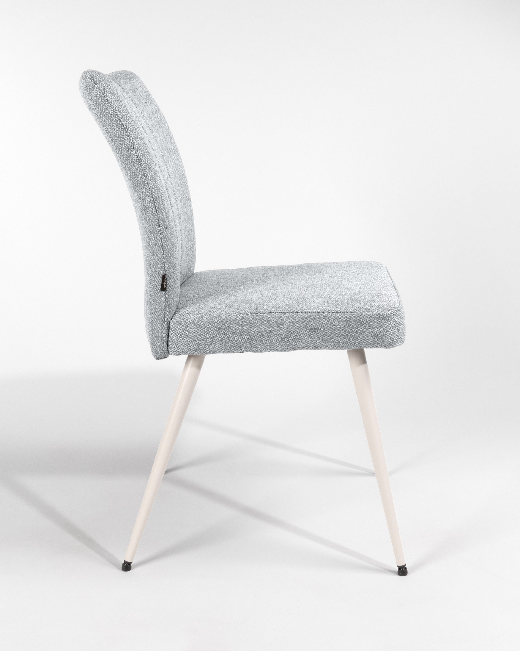 Tucson chair with gray upholstery and ivory metal legs