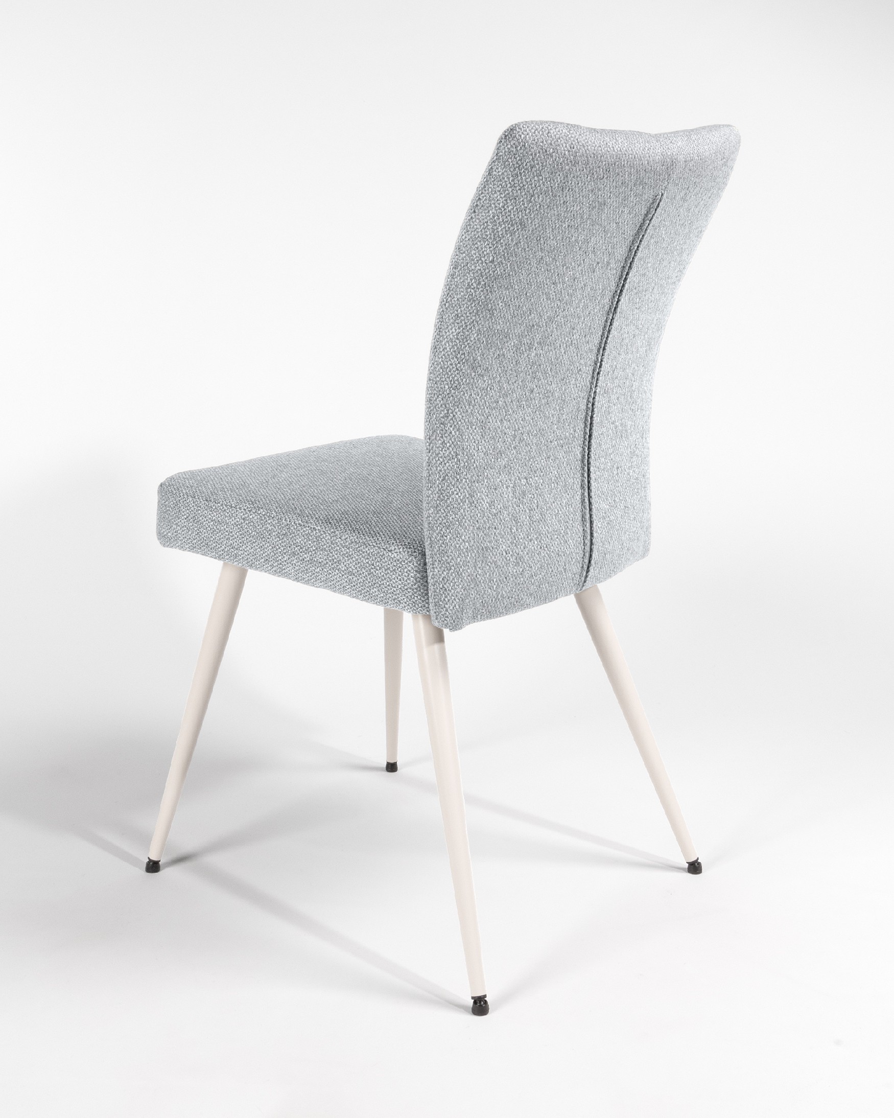 Tucson chair with gray upholstery and ivory metal legs