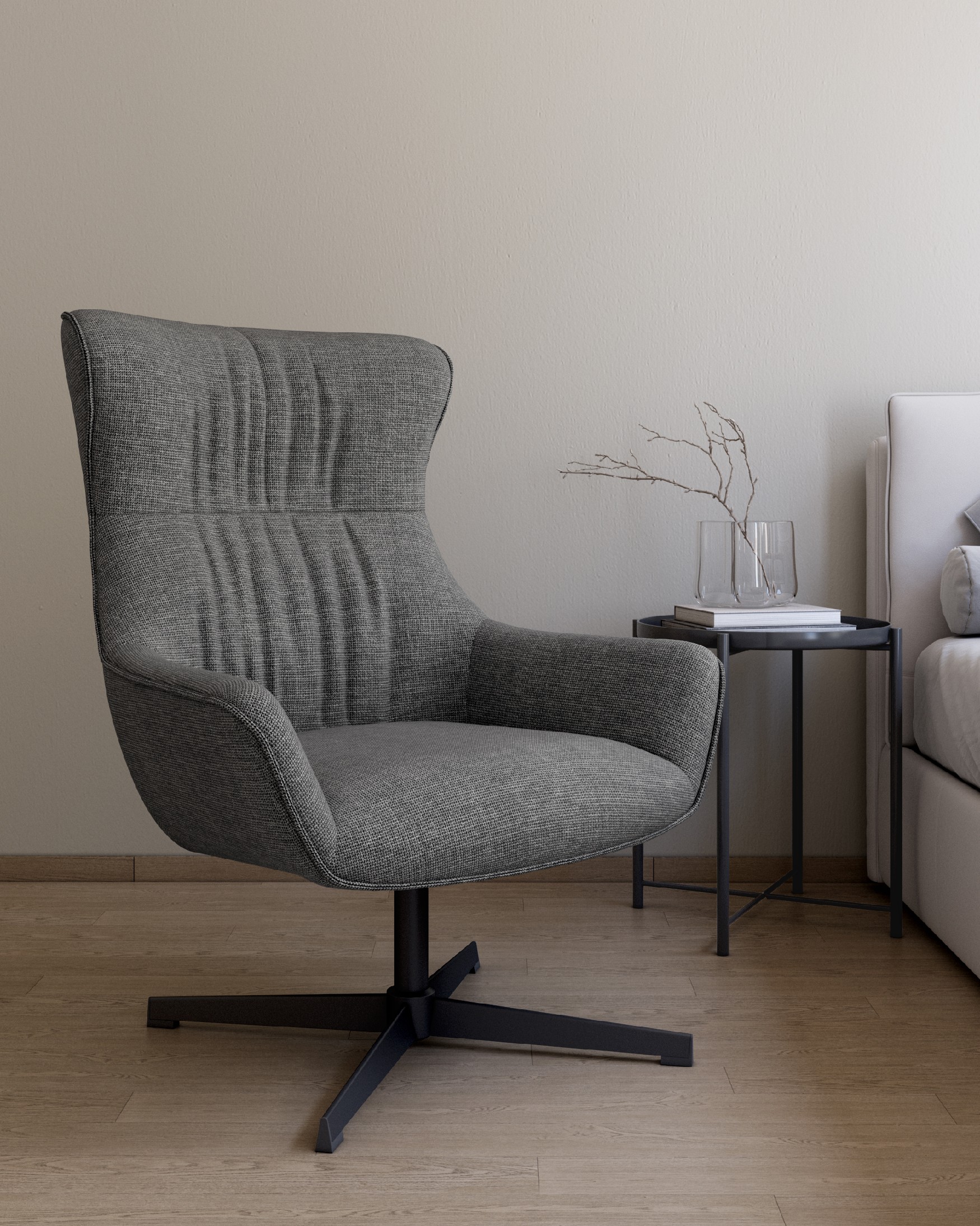 Tulip swivel armchair with gray upholstery and black metal legs.
