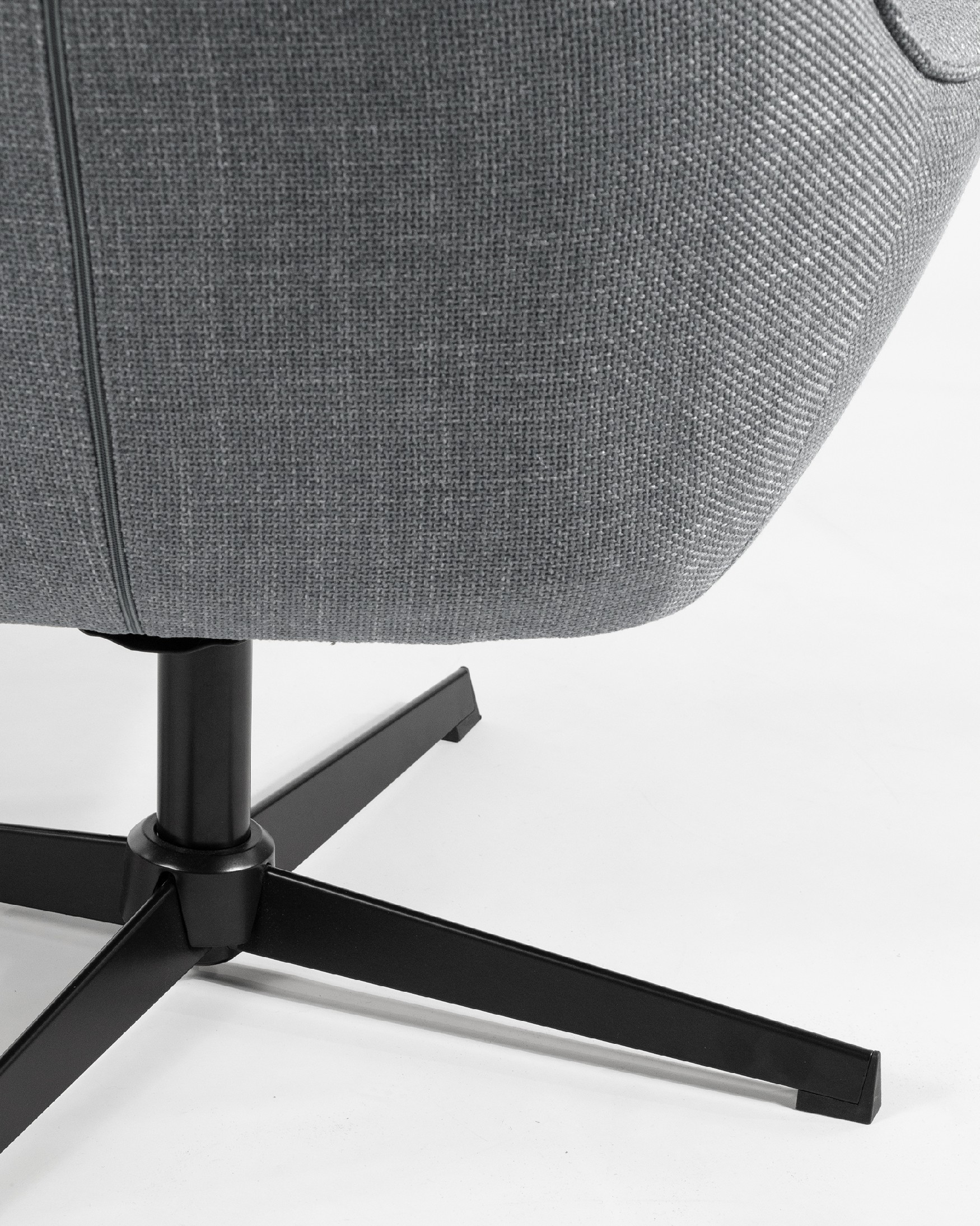 Tulip swivel armchair with gray upholstery and black metal legs.