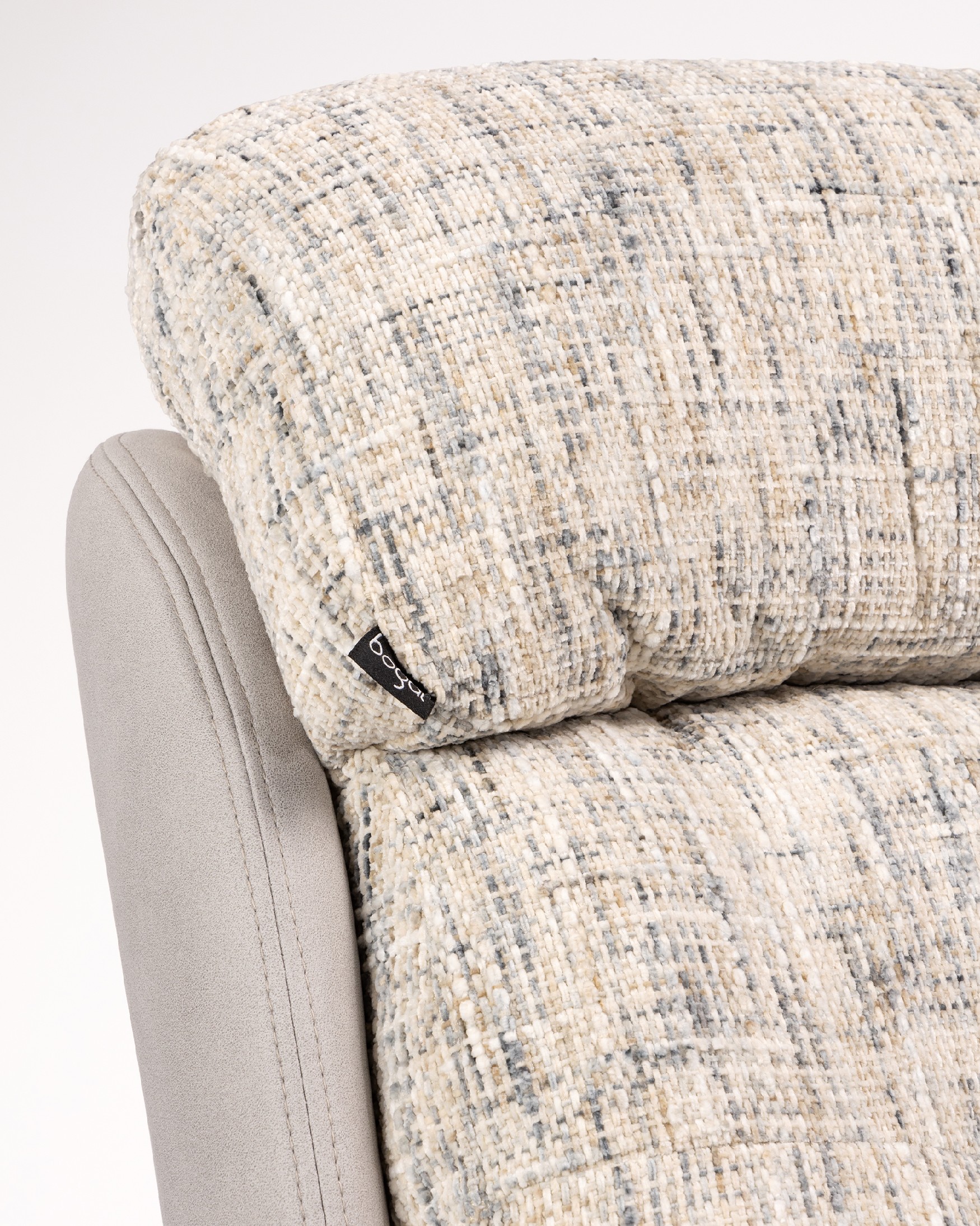 Tunia armchair with pearl and cloud upholstery and black metal frame ottoman, 360° swivel rocking.