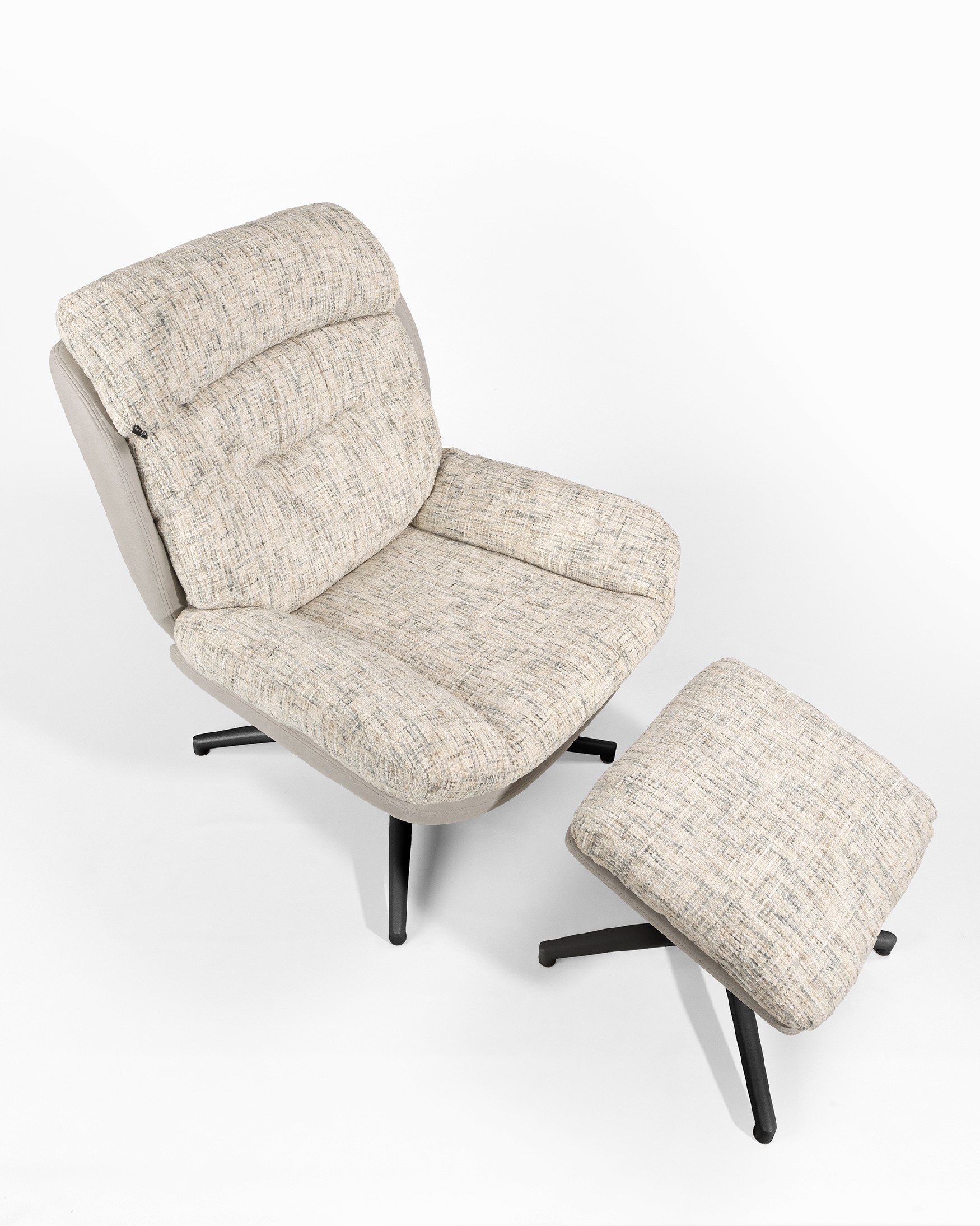Tunia armchair with pearl and cloud upholstery and black metal frame ottoman, 360° swivel rocking.