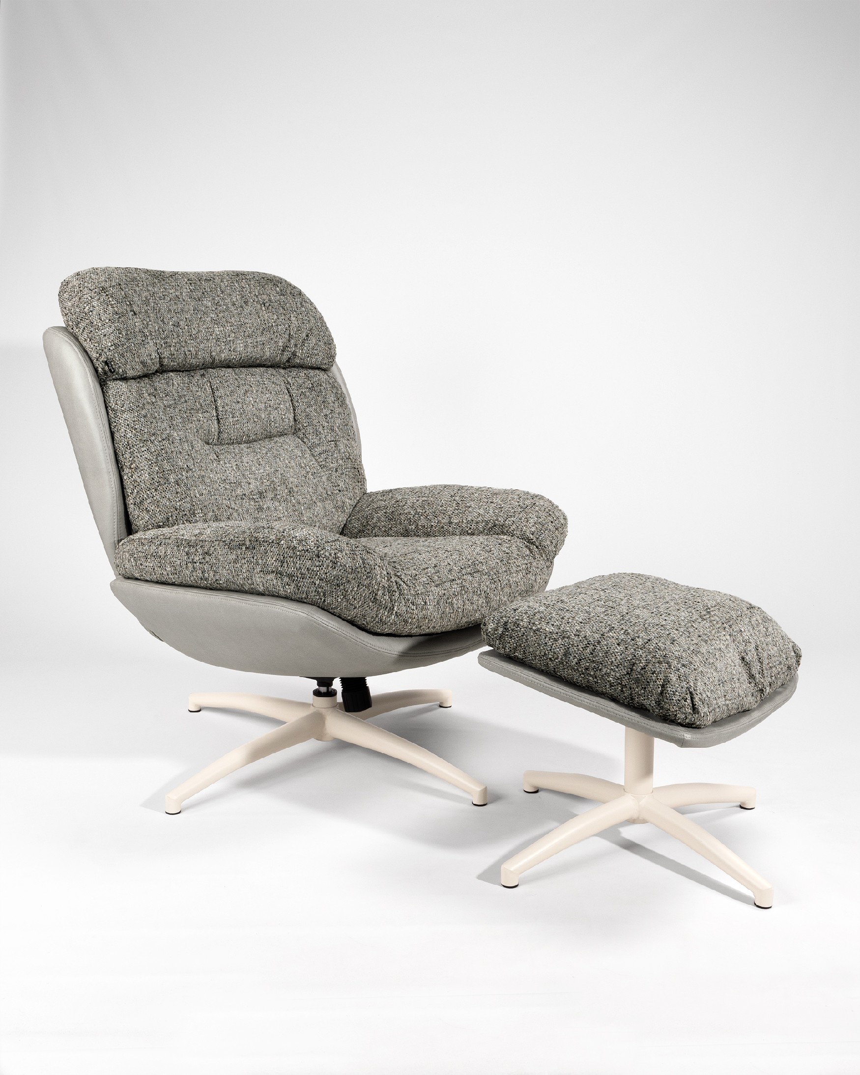 Velina armchair with gray and storm upholstery with ivory metal structure ottoman, 360° swivel rocking.