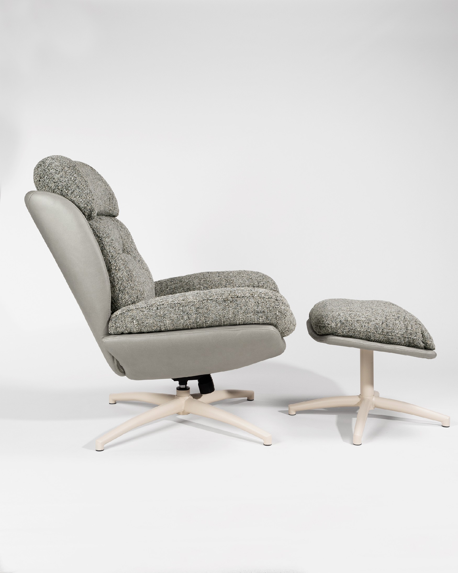 Velina armchair with gray and storm upholstery with ivory metal structure ottoman, 360° swivel rocking.
