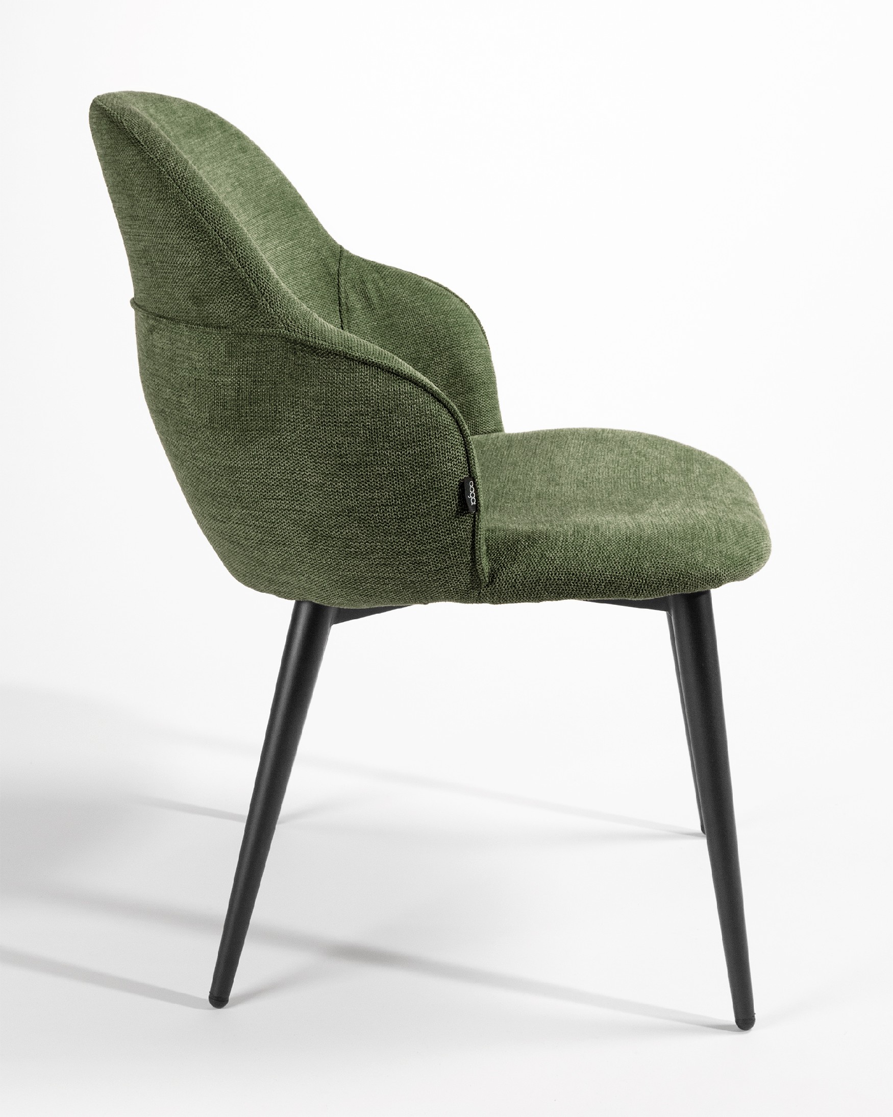 Chaise Venise avec un revêtement vert et des pieds métalliques noirs