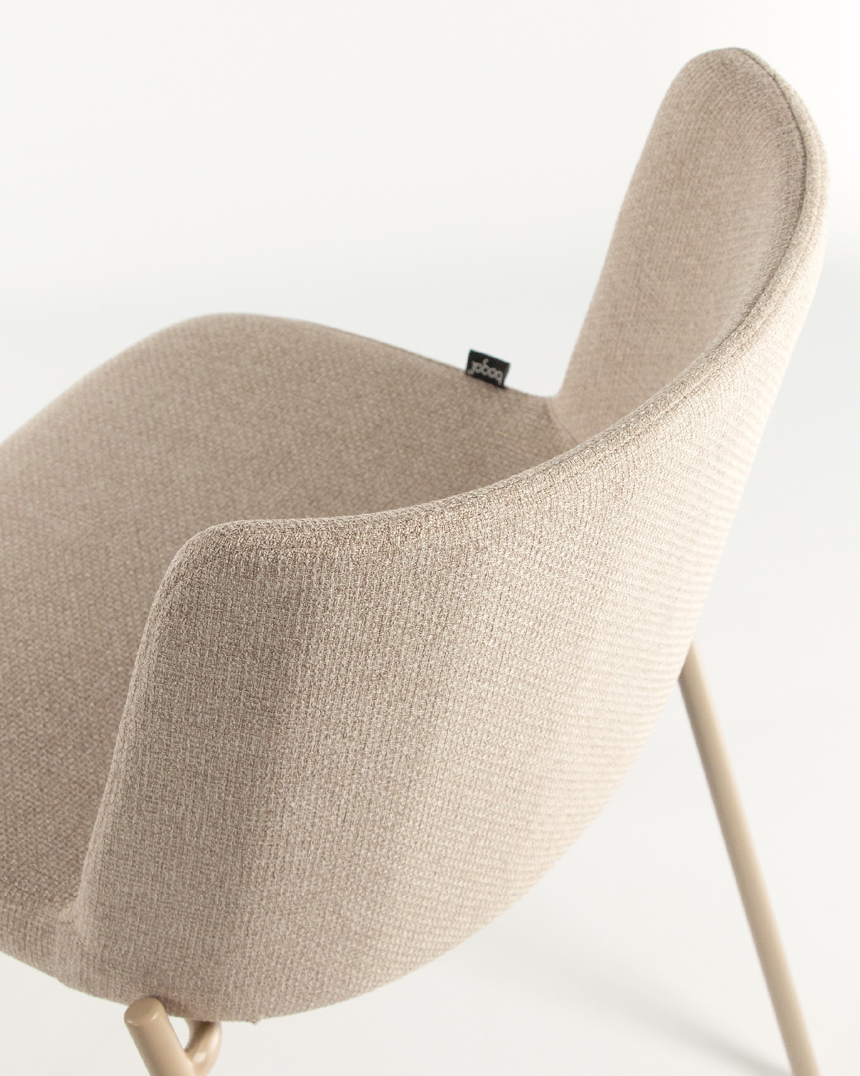 York chair with cream upholstery and matching metal legs