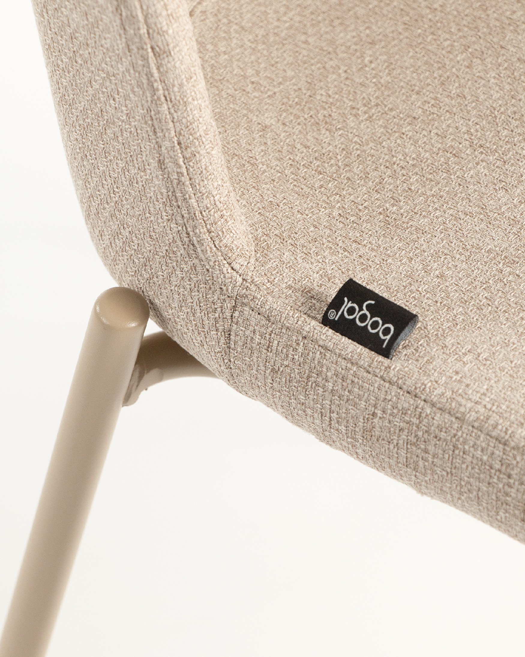 York chair with cream upholstery and matching metal legs
