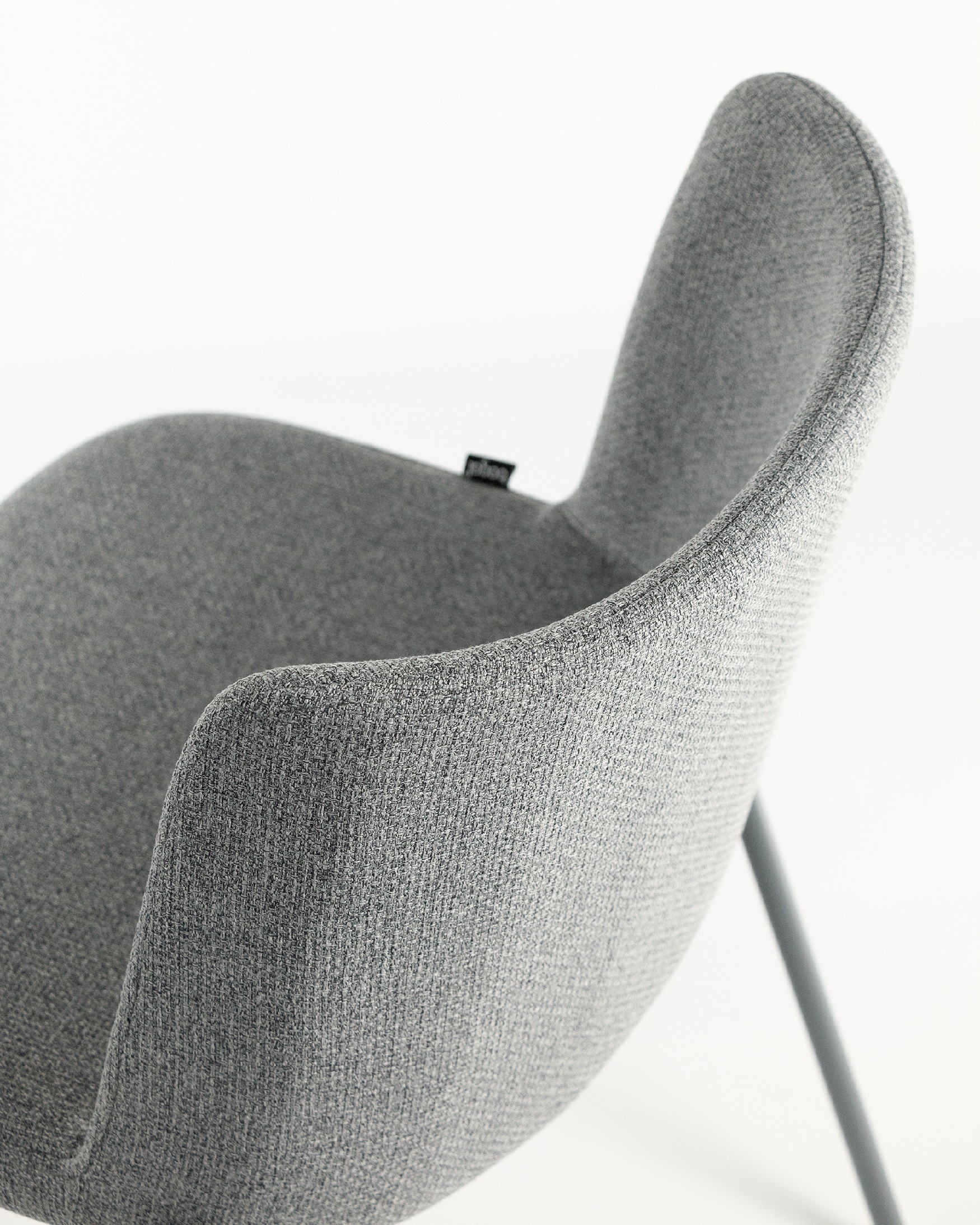 York chair with gray upholstery and matching metal legs