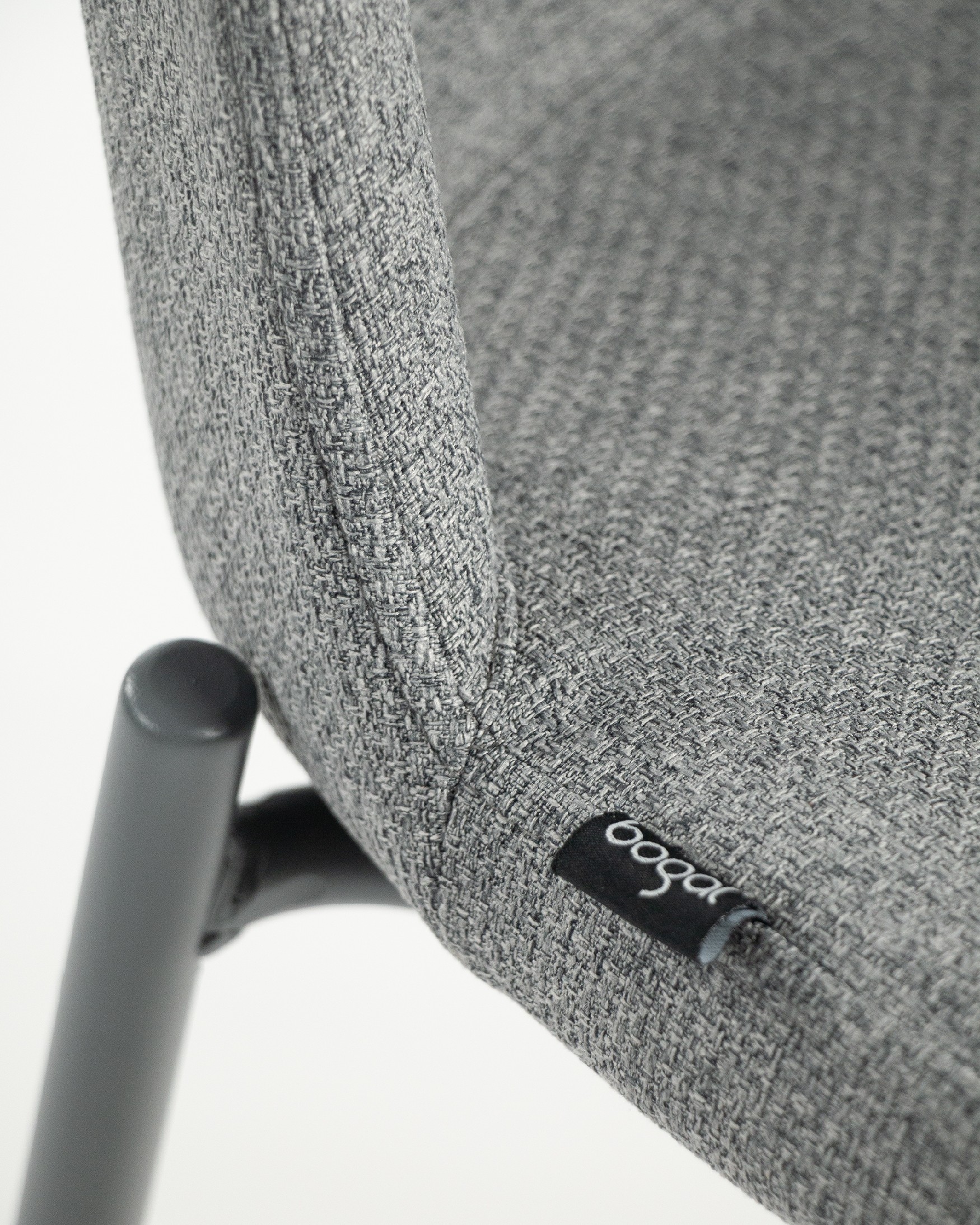 York chair with gray upholstery and matching metal legs