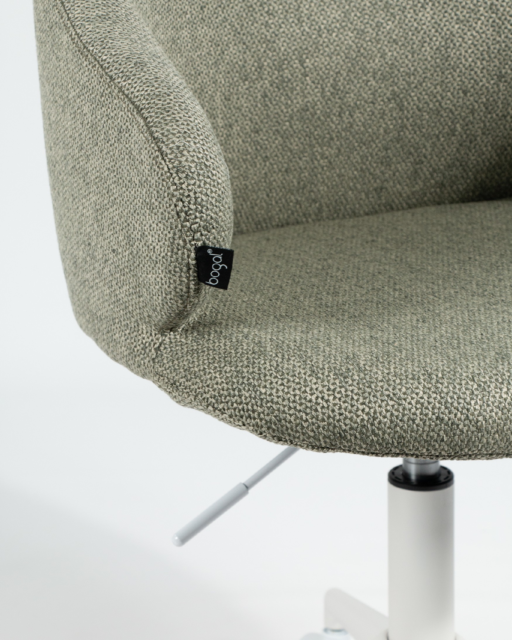 Zurich chair with green upholstery and white metal legs